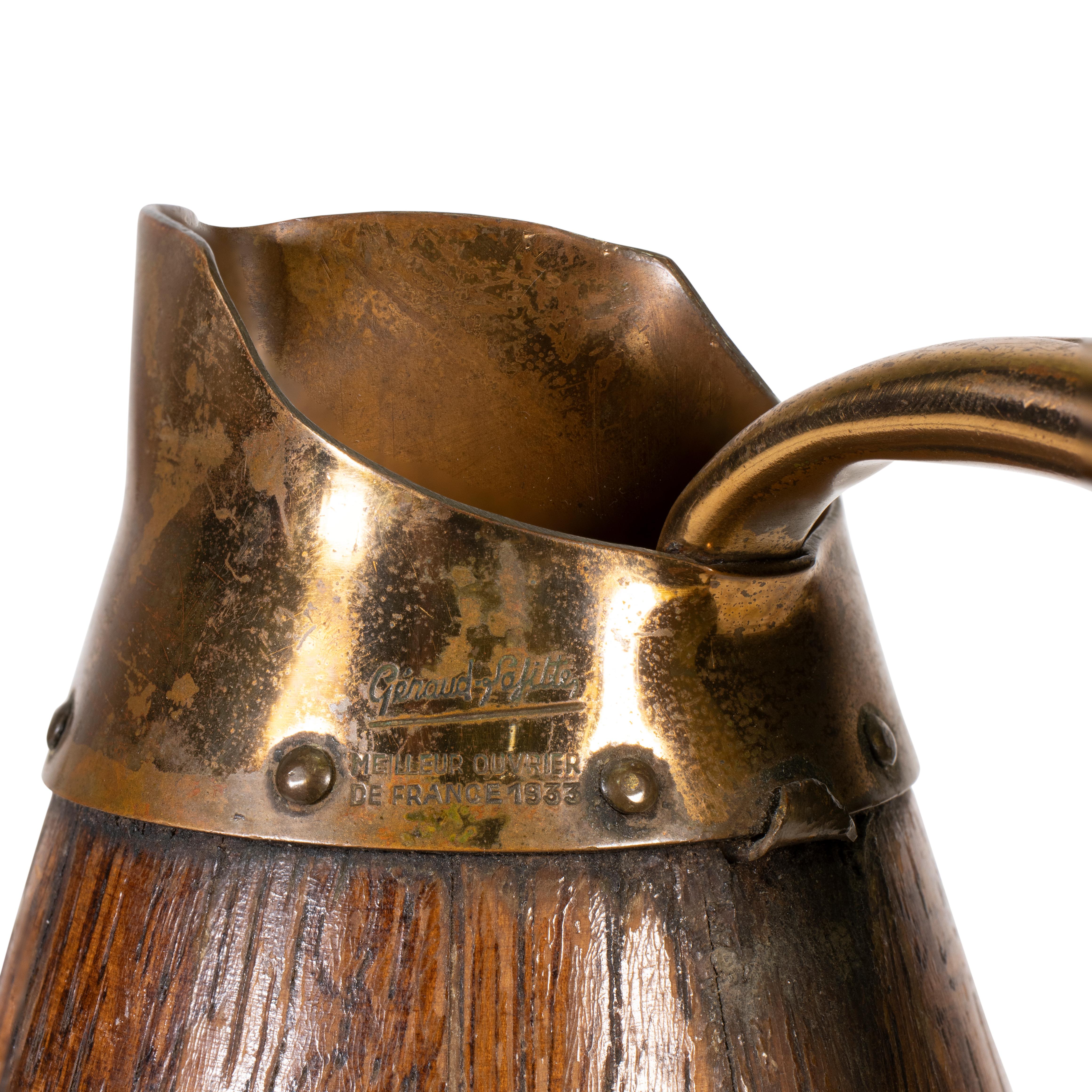 Miniature French oak and brass banded wine pitcher. A great barware piece!

Period: Early 20th Century
Origin: France
Size: 8 1/4