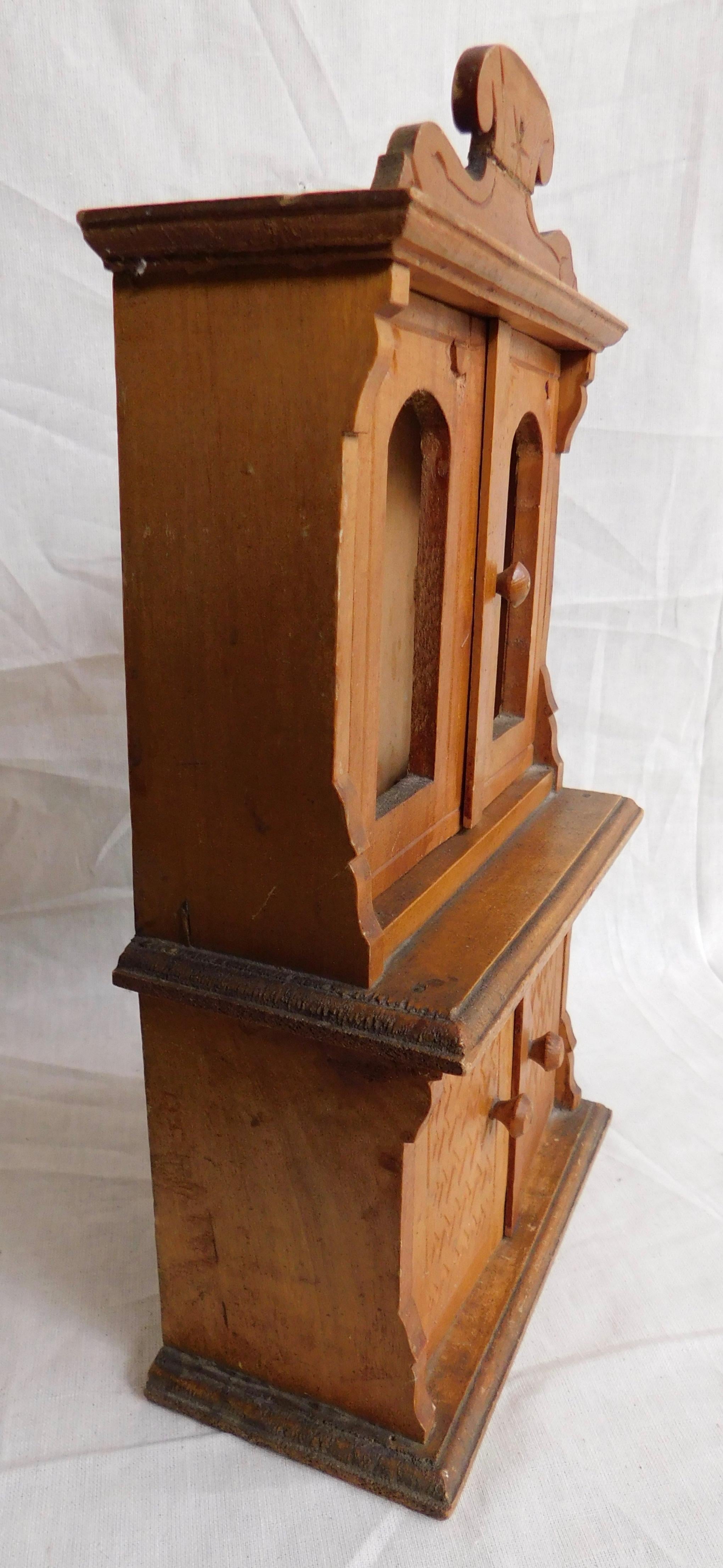 Miniature French cabinet, circa 1900. Top and bottom doors open.