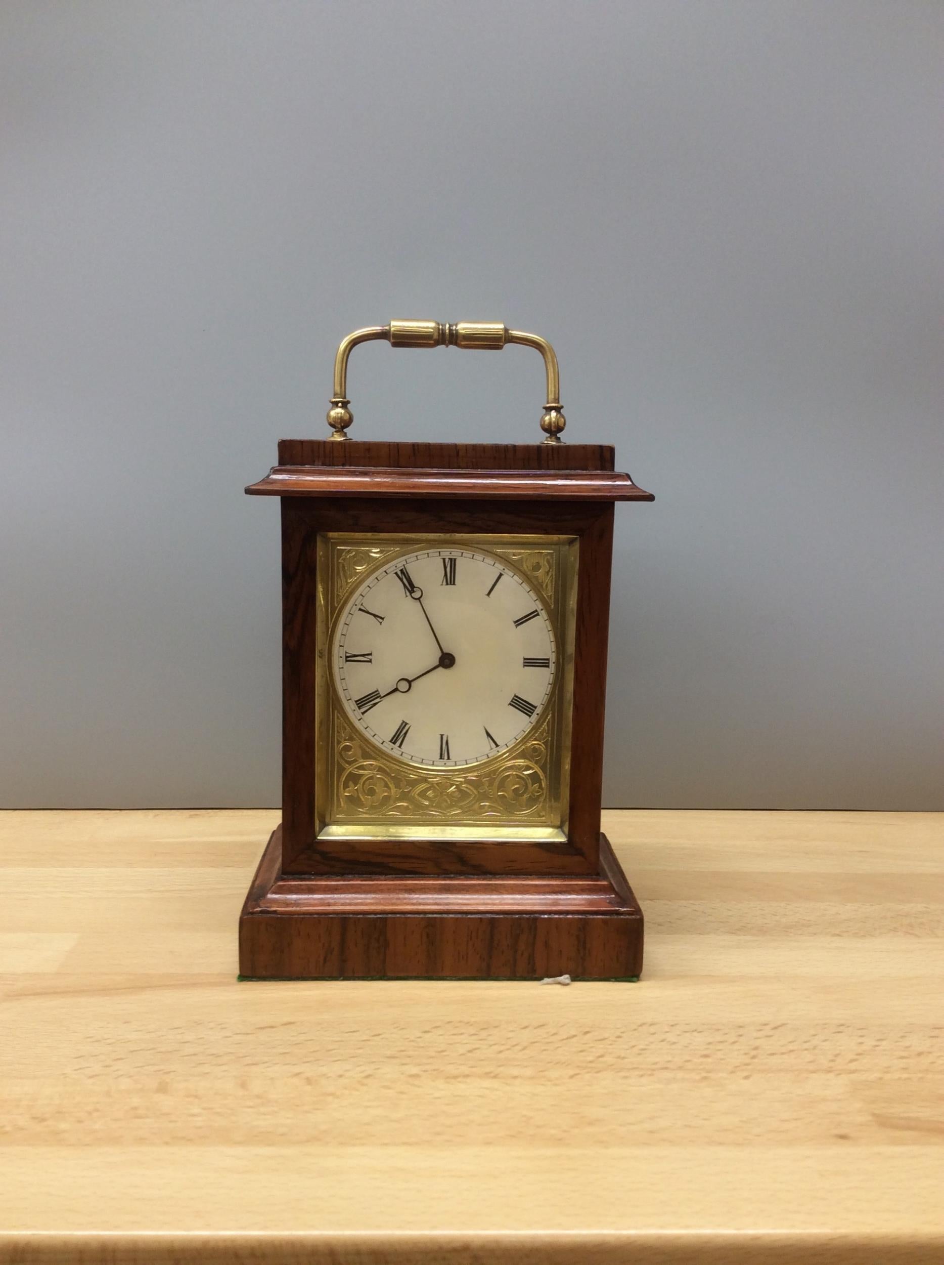 Miniature rosewood French mantel clock

Miniature French mantel clock in a rosewood case sitting on a moulded plinth with brass carrying handle.

Engraved gilded mask surrounding an enamel dial with Roman numerals and original ‘blued’ steel