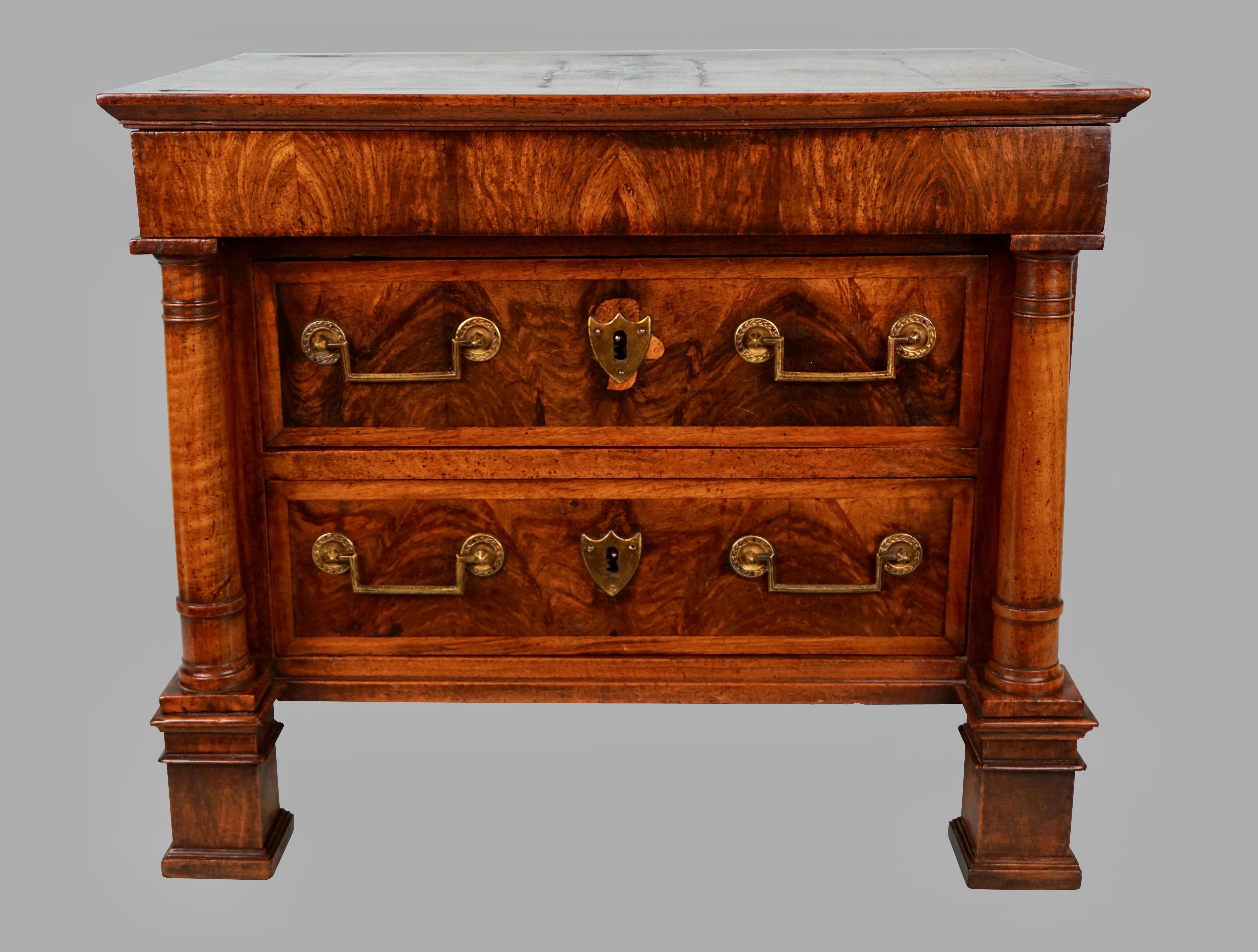 A fine quality French Empire period walnut 3 drawer commode, with one small and 2 large drawers, possessing wonderful old color and patina. This piece, possibly a cabinet makers sample, has 3 oak line drawers including a top drawer with secret