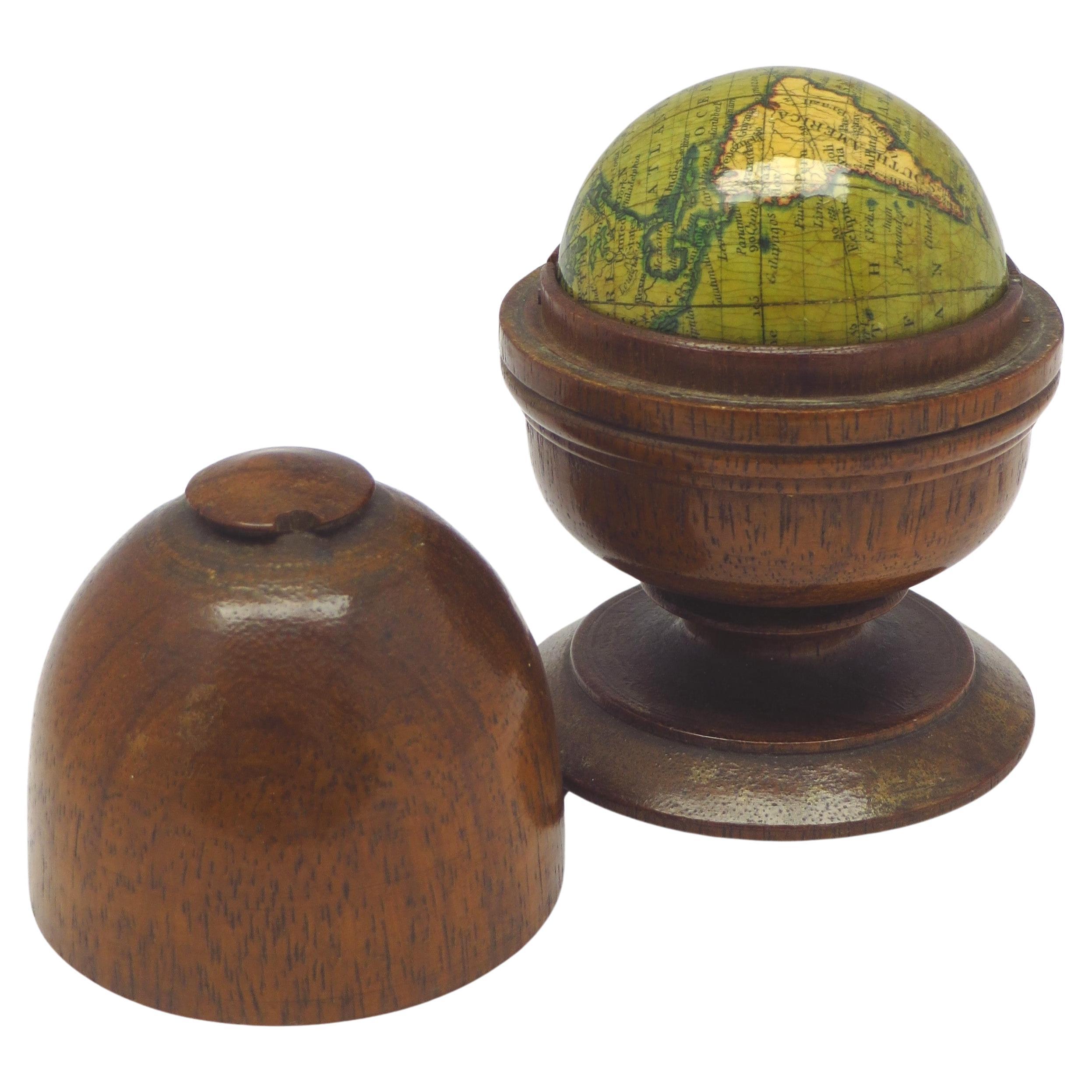 Miniature globe in aturned and stained beech For Sale
