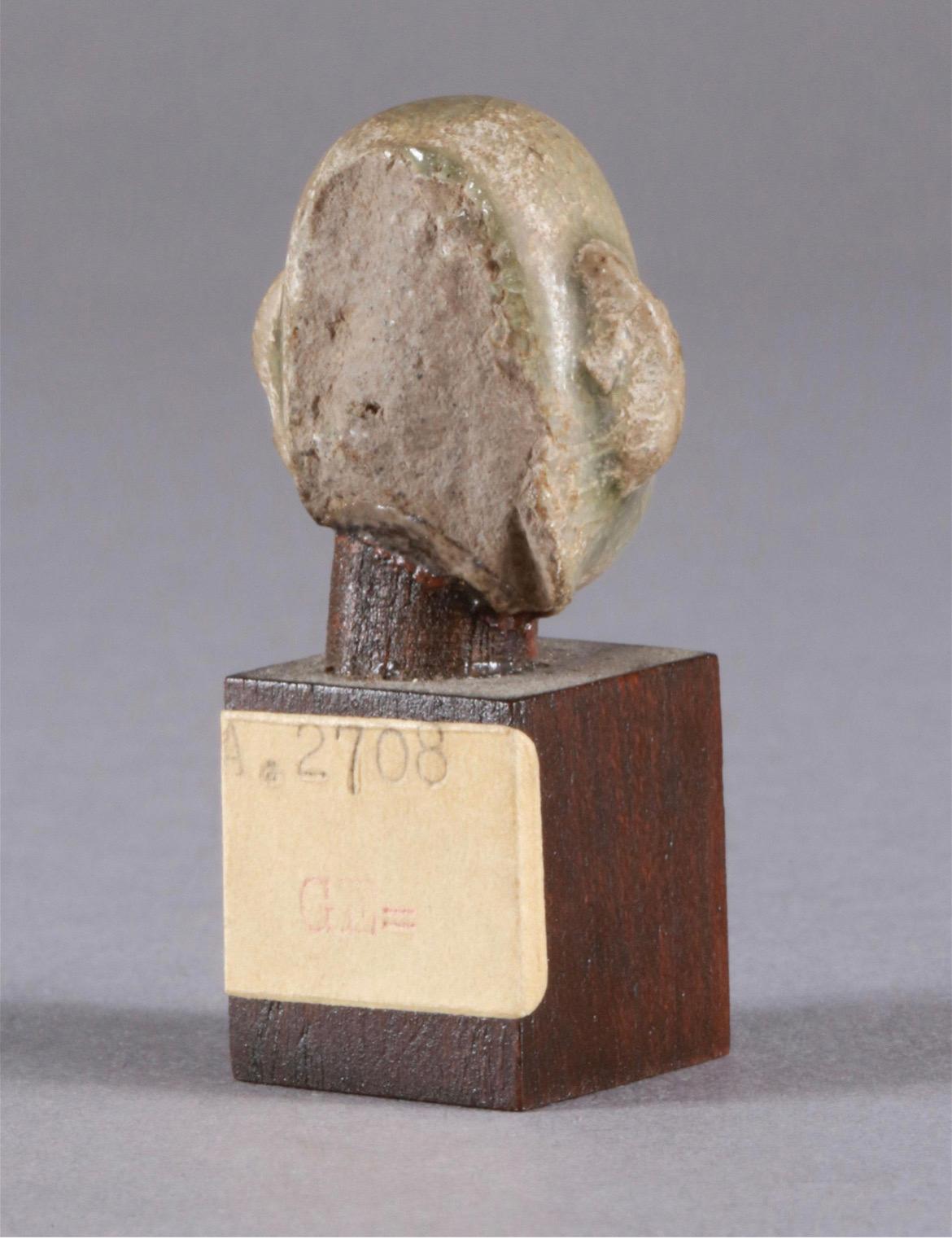 Miniature Head Made of Ceramics on Wooden Base, Cambodia, 20th Century In Good Condition For Sale In Basel, BS