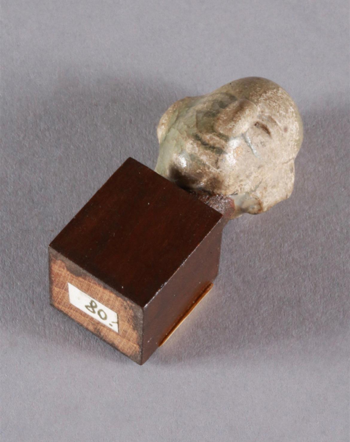 Miniature Head Made of Ceramics on Wooden Base, Cambodia, 20th Century For Sale 1
