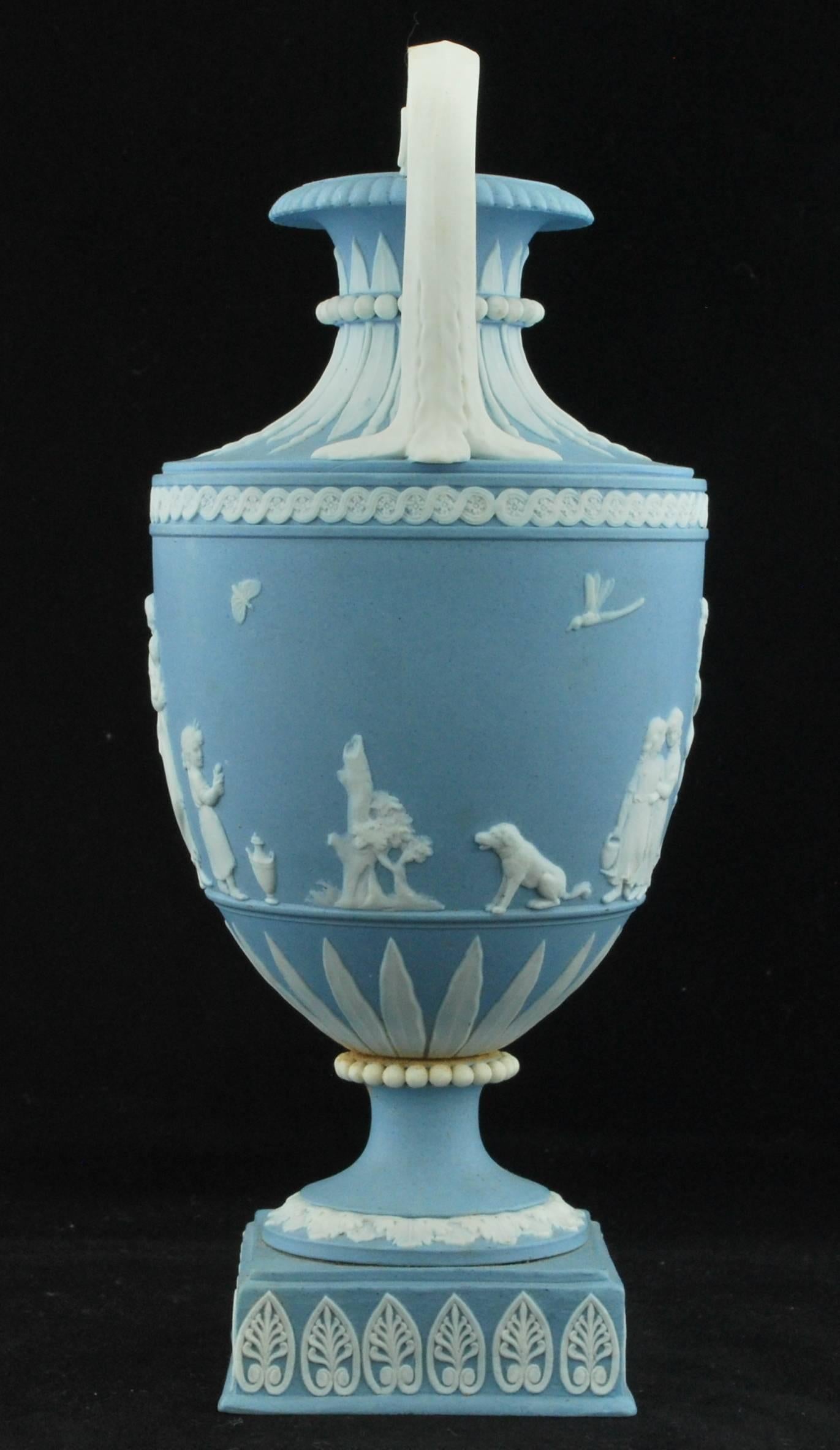 A delightful example of early jasperware in the shape of a miniature vase in solid pale blue, decorated with domestic employment by Lady Templetown.


    