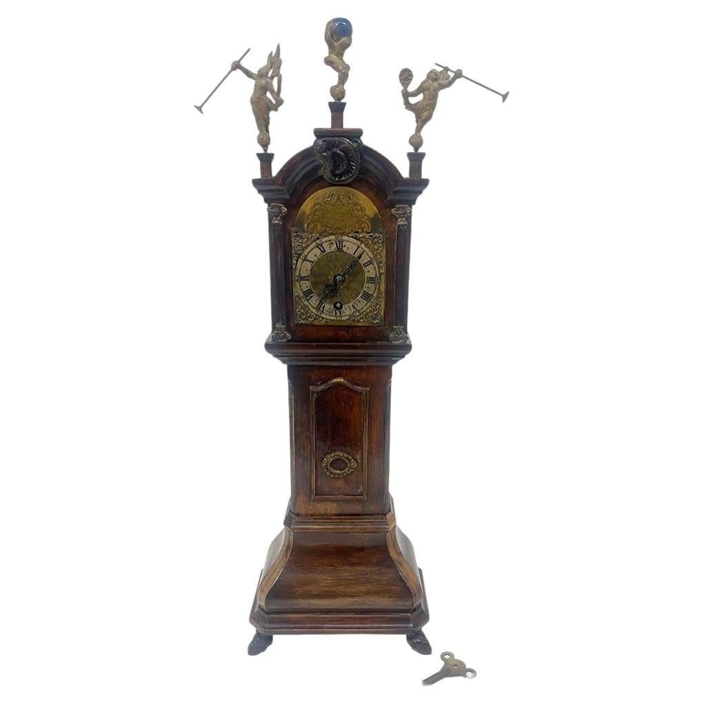 What is a mini grandfather clock called?