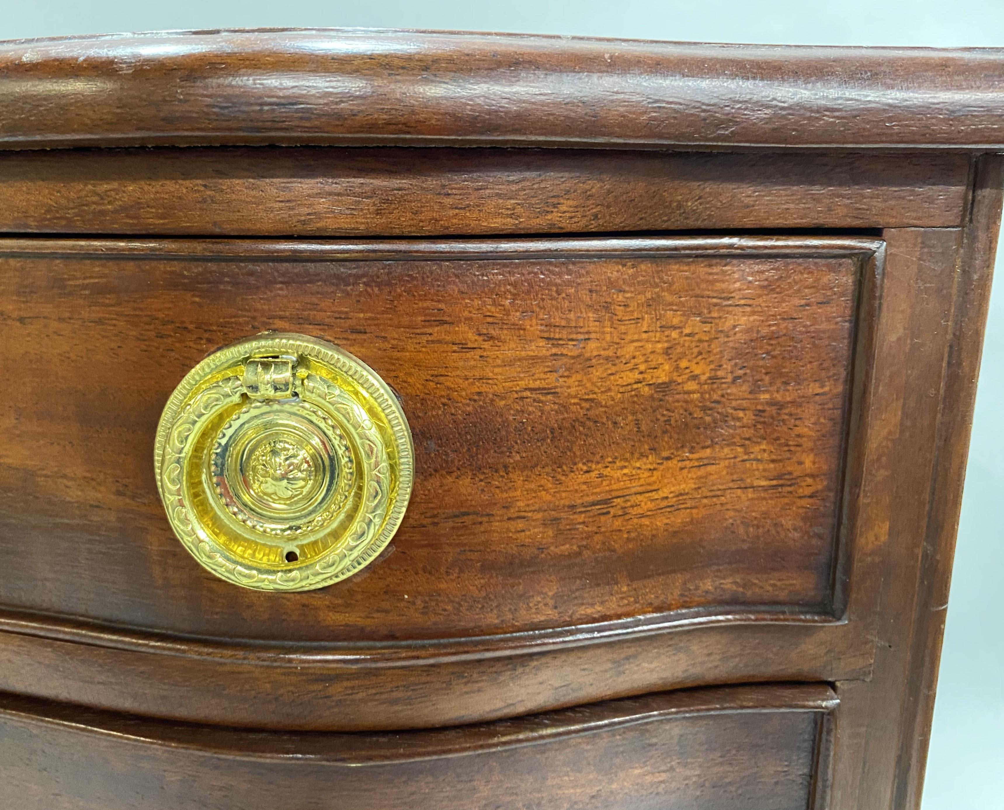 Hand-Carved Miniature Mahogany Serpentine Three Drawer Chest with Round Brass Pulls For Sale