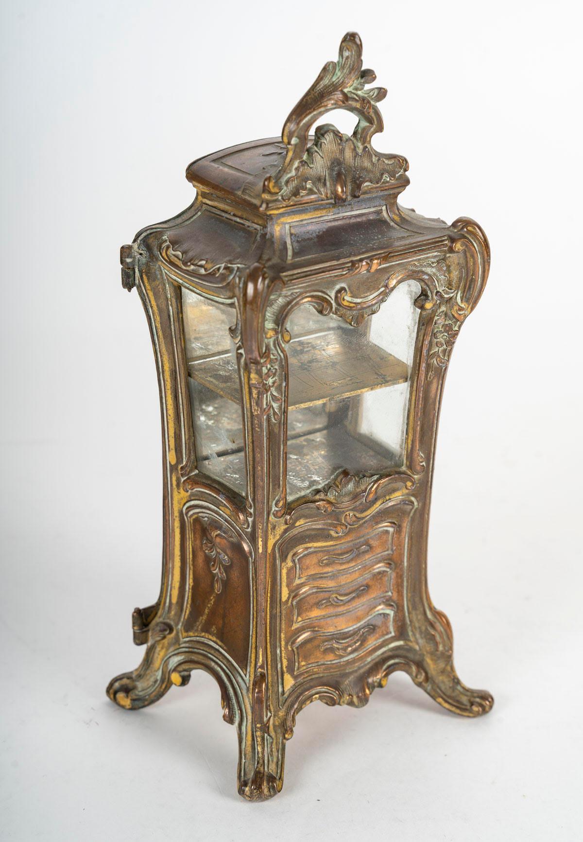 Miniature metal and glass display case, 19th century, Napoleon III period.

Miniature metal and glass display case, 19th century, Napoleon III period.
H: 22cm, W: 9.5cm, D: 7.5cm