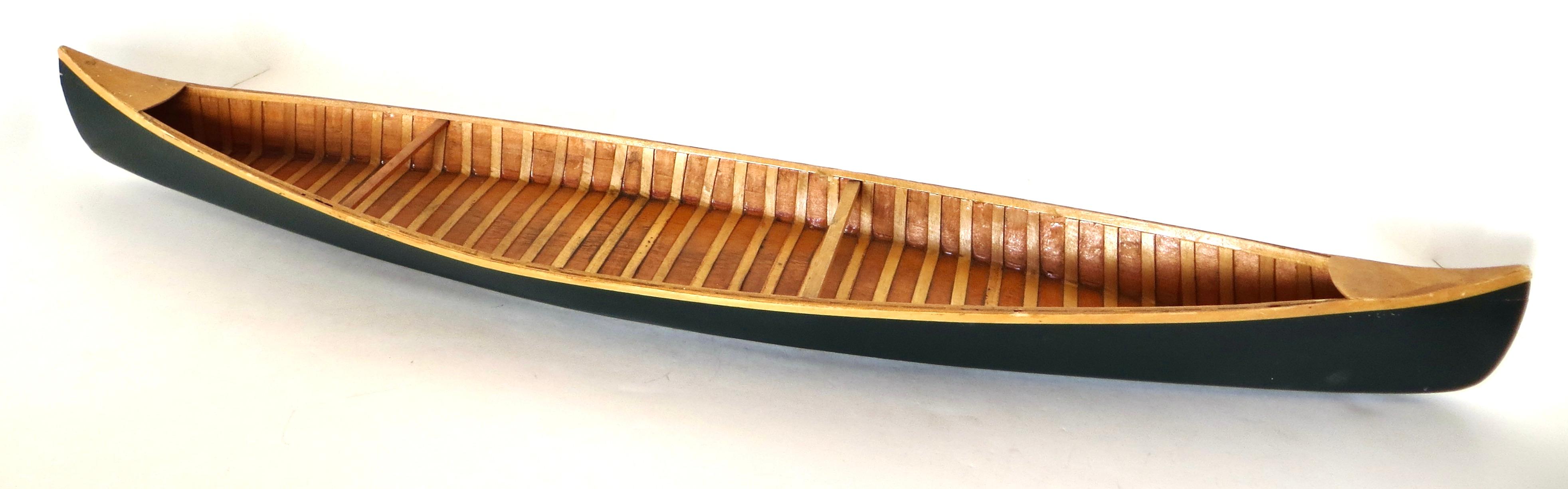 While this model canoe might have been used as a salesman sample, whereby merchants, carried it from town to town to encourage sales, it was more than likely used as a demonstration model or a display piece in showrooms by the retailer with limited
