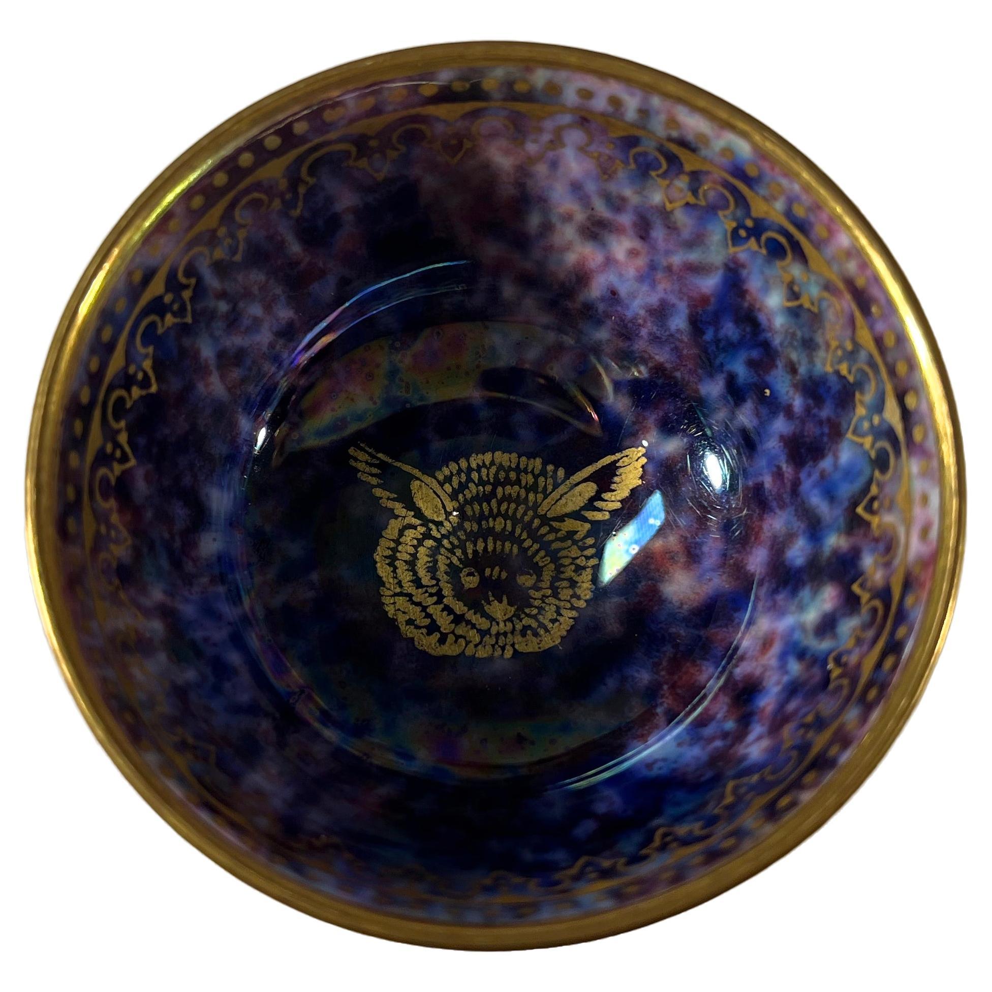 Fabulous gilded, a 'strange large eared creature' decorates the interior of this miniature bowl by Daisy Makeig-Jones for Wedgwood
Miniature bone china lustre tea bowl gilded in filigree to inner and outer rims
The interior is decorated with indigo