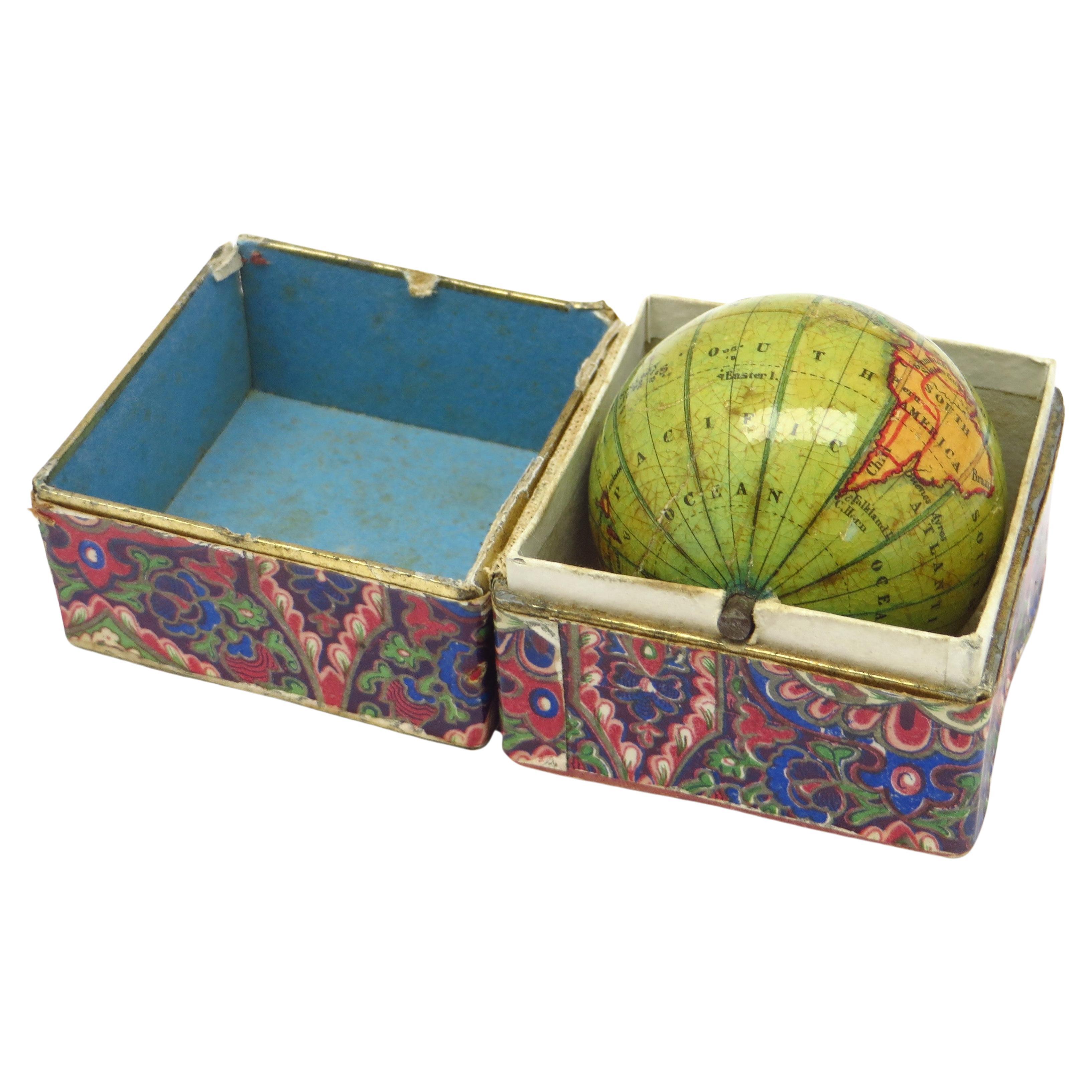 Miniature pocket globe in colourful card box For Sale