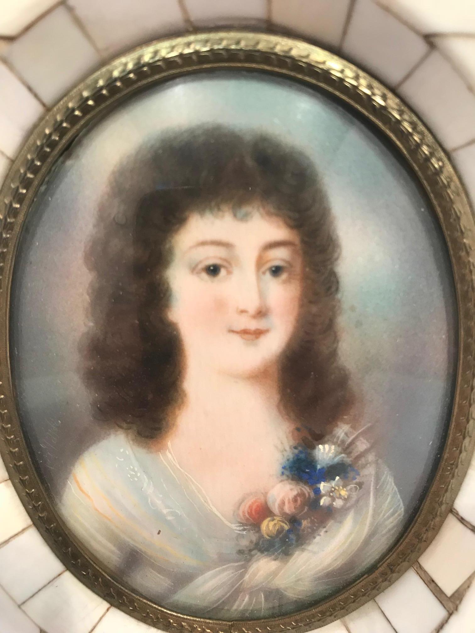 Miniature portrait of a beautiful young lady in a bone frame with a repoussé inner gilt brass filet. The portrait is hand painted on bone and retains its original crown glass.

(This item is eligible for a complimentary gift box upon request.)