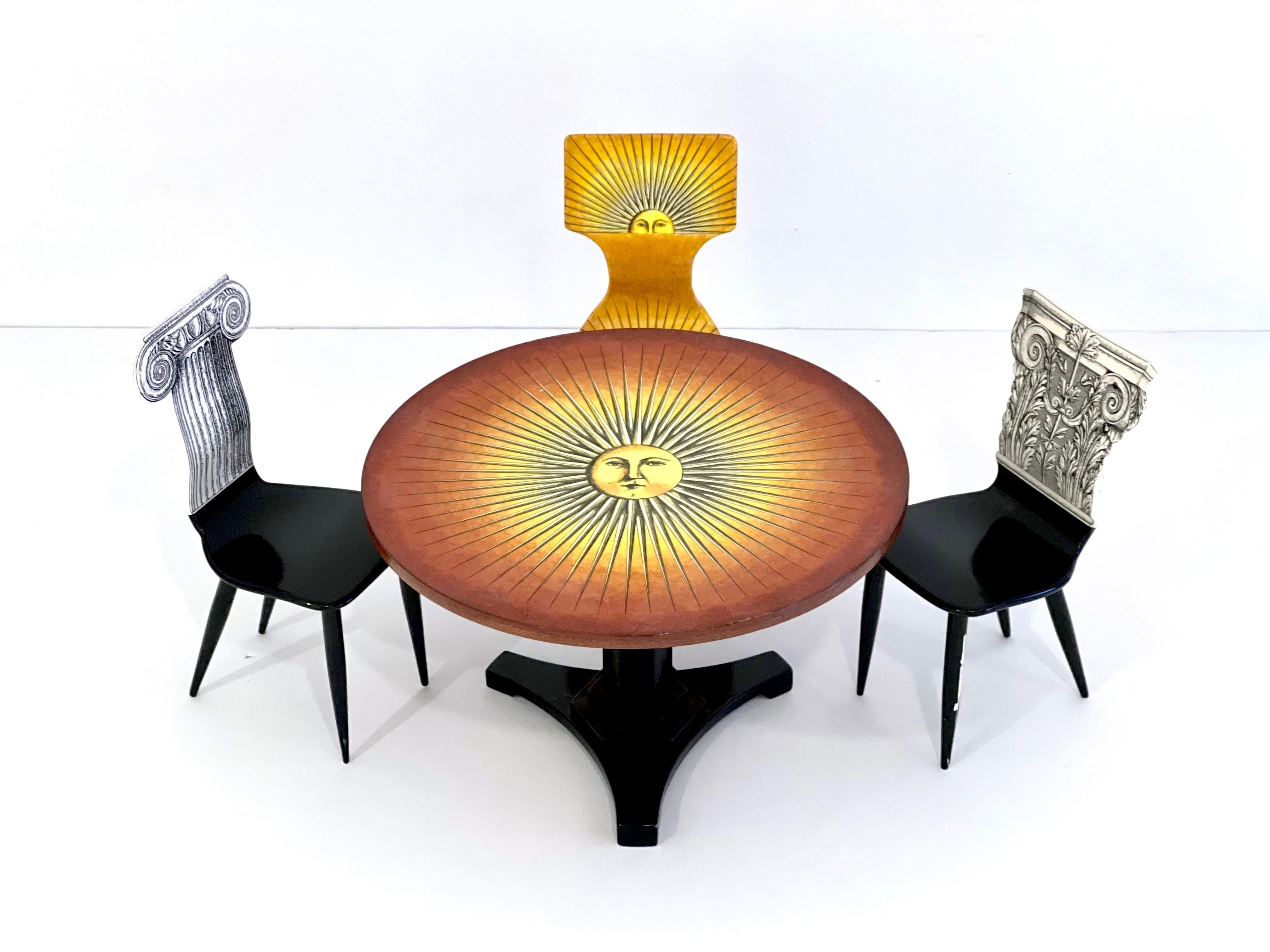Rare and spectacular set of Miniature Prototype Table and Chairs by Piero Fornasetti, Italy circa 1970's. The chairs are stamped 'Fornasetti Milano' on the underside. 
The measurements listed are for the table. 
The chairs measure approx. 9.5