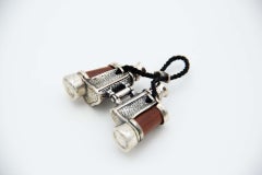 Miniature silver binoculars