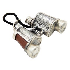 Miniature silver binoculars