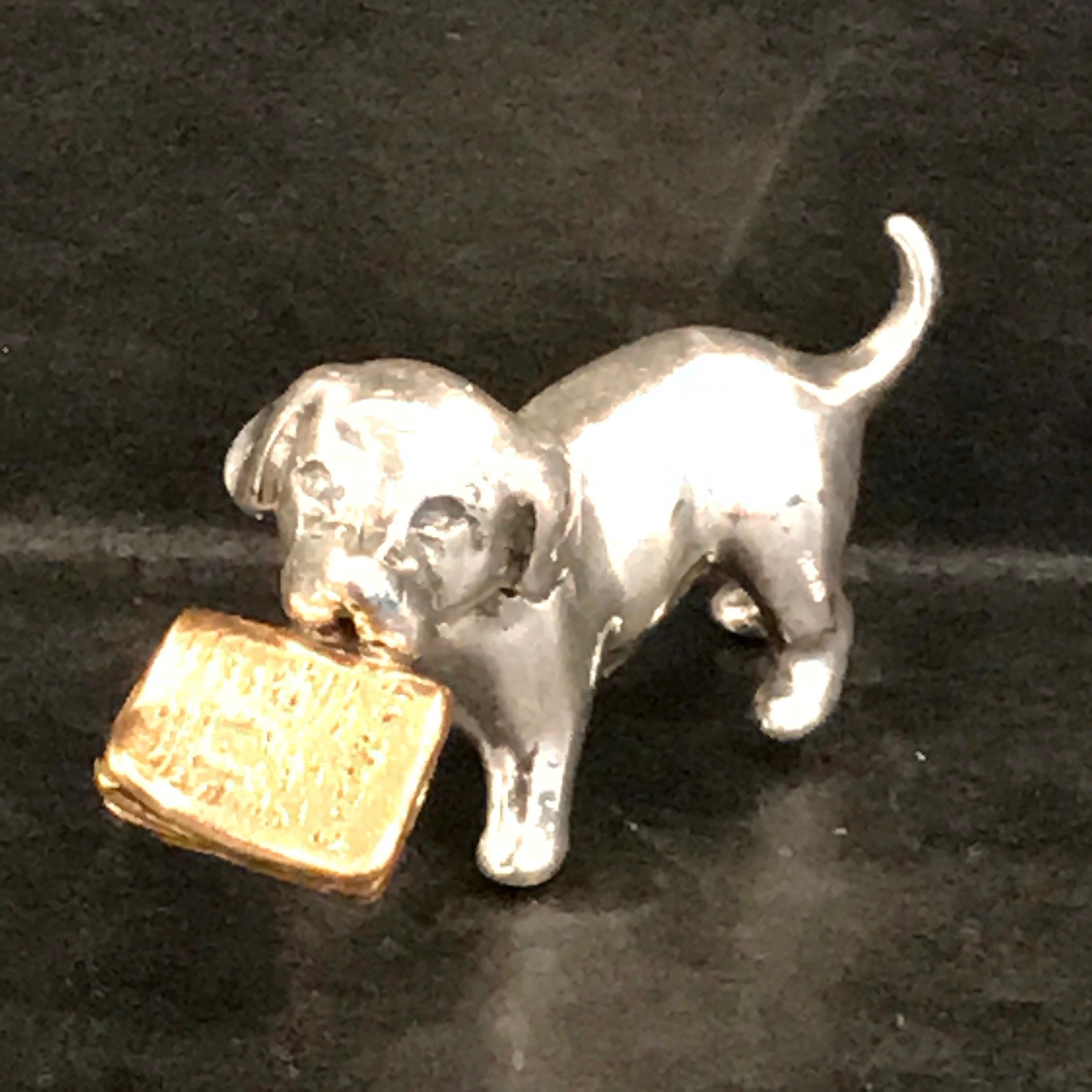 Miniature silver dog with Vermeil Newspaper by Sorini, finely cast, marked Sorini, stamped .800.