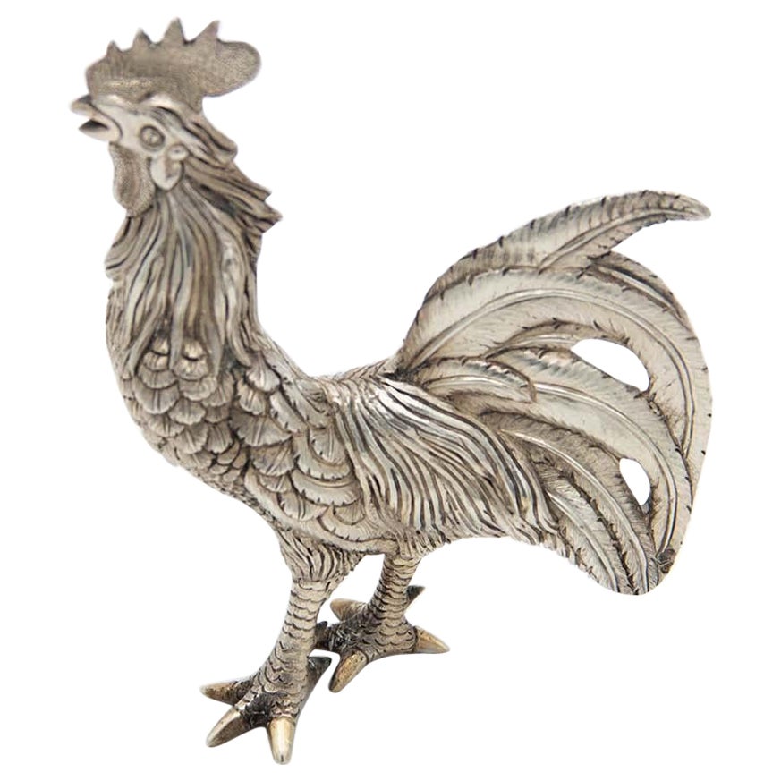 Miniature silver rooster with low reliefs en venta