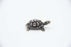 Miniature silver turtle with reliefs