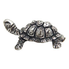 Miniature silver turtle with reliefs