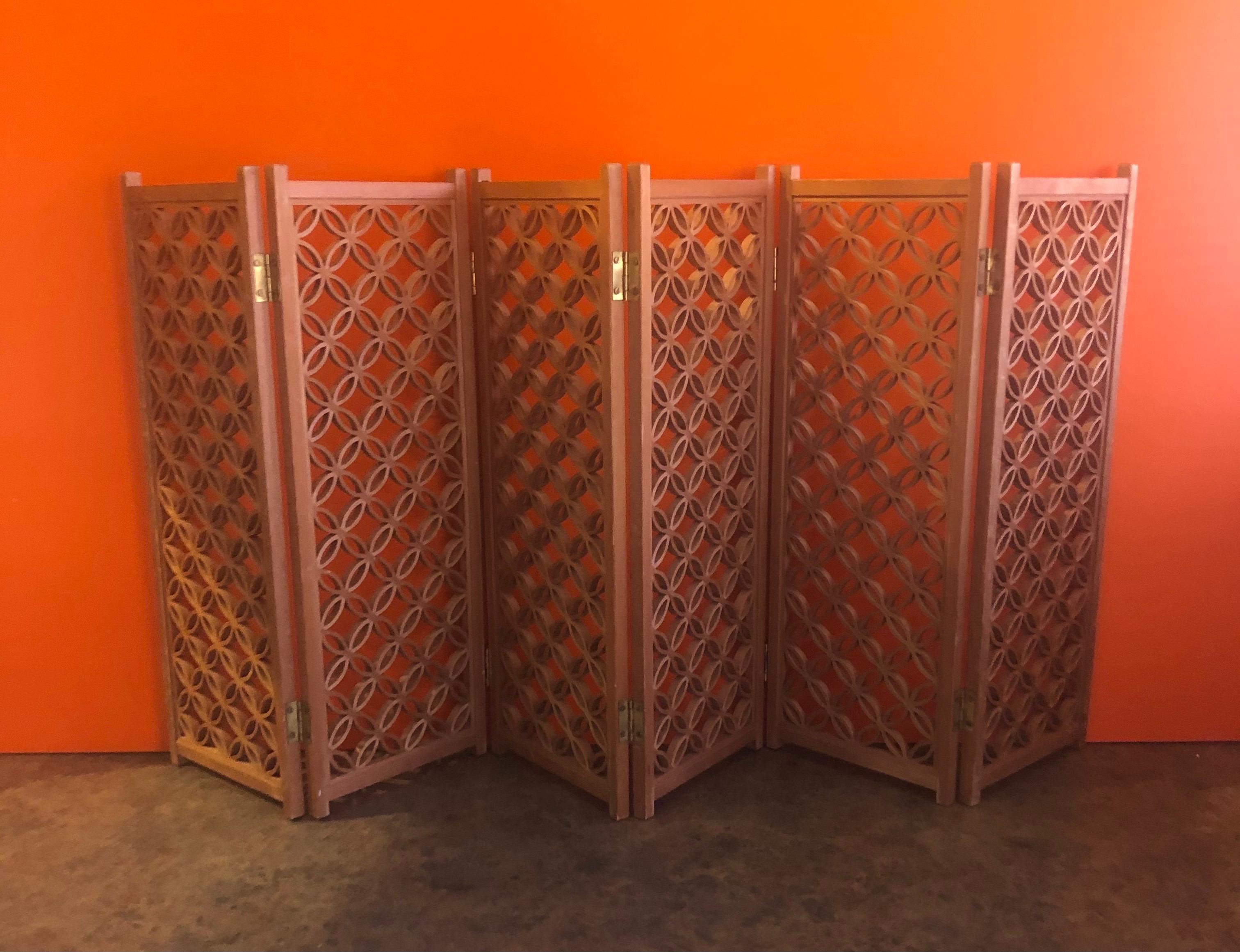 A very cool miniature six panel folding screen with intricate circular design in wood, circa 1970s. Each individual panel measures 5