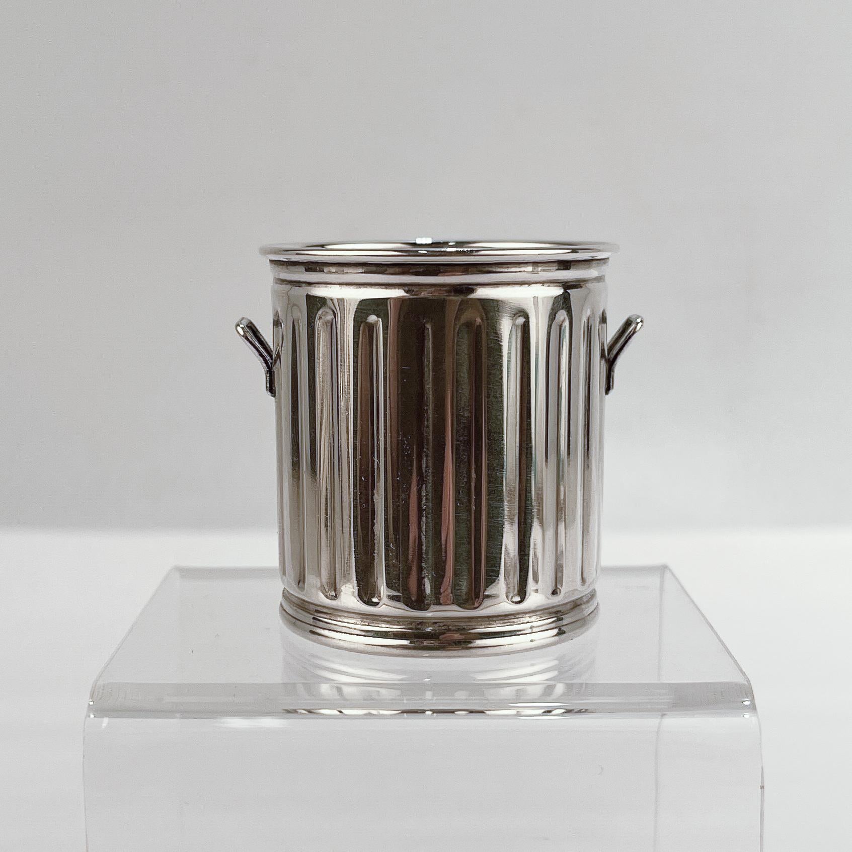 silver trashcan