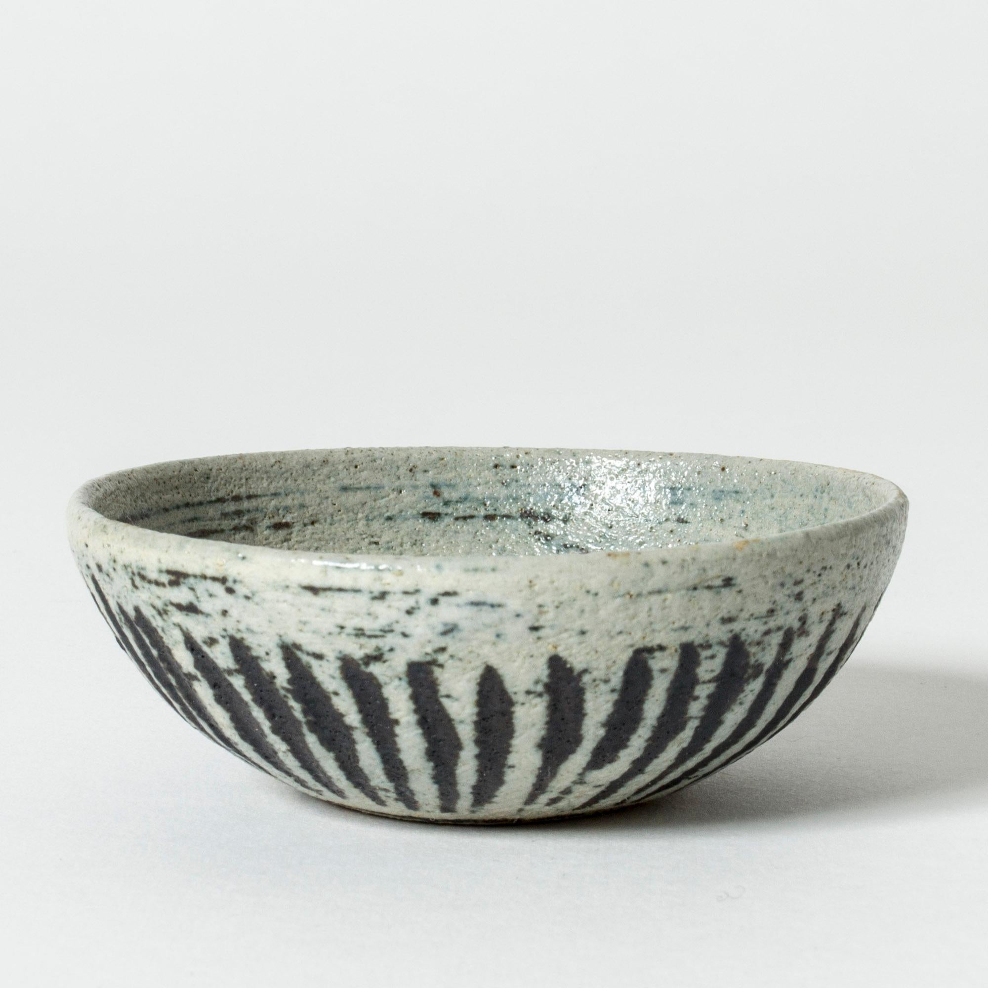 Miniature stoneware bowl by Anders B. Liljefors, with a structured, organic surface. Graphic pattern in blue and brown.

Anders B. Liljefors was a Swedish ceramicist, sculptor and painter. He spent a total of ten years at Gustavsberg, first from