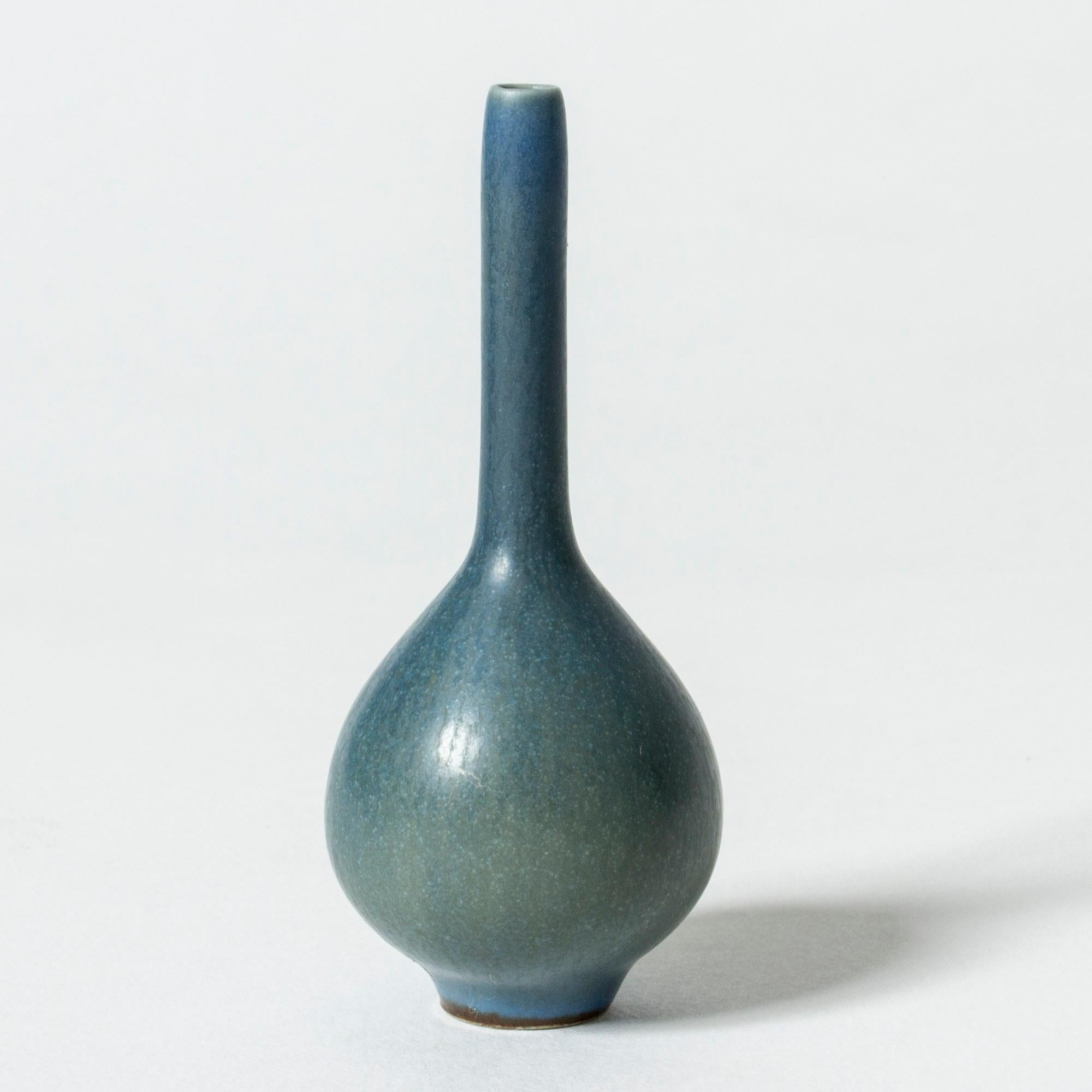 Miniature stoneware vase by Berndt Friberg, in an onion form with a striking, straight neck. Vibrant blue hare’s fur glaze.