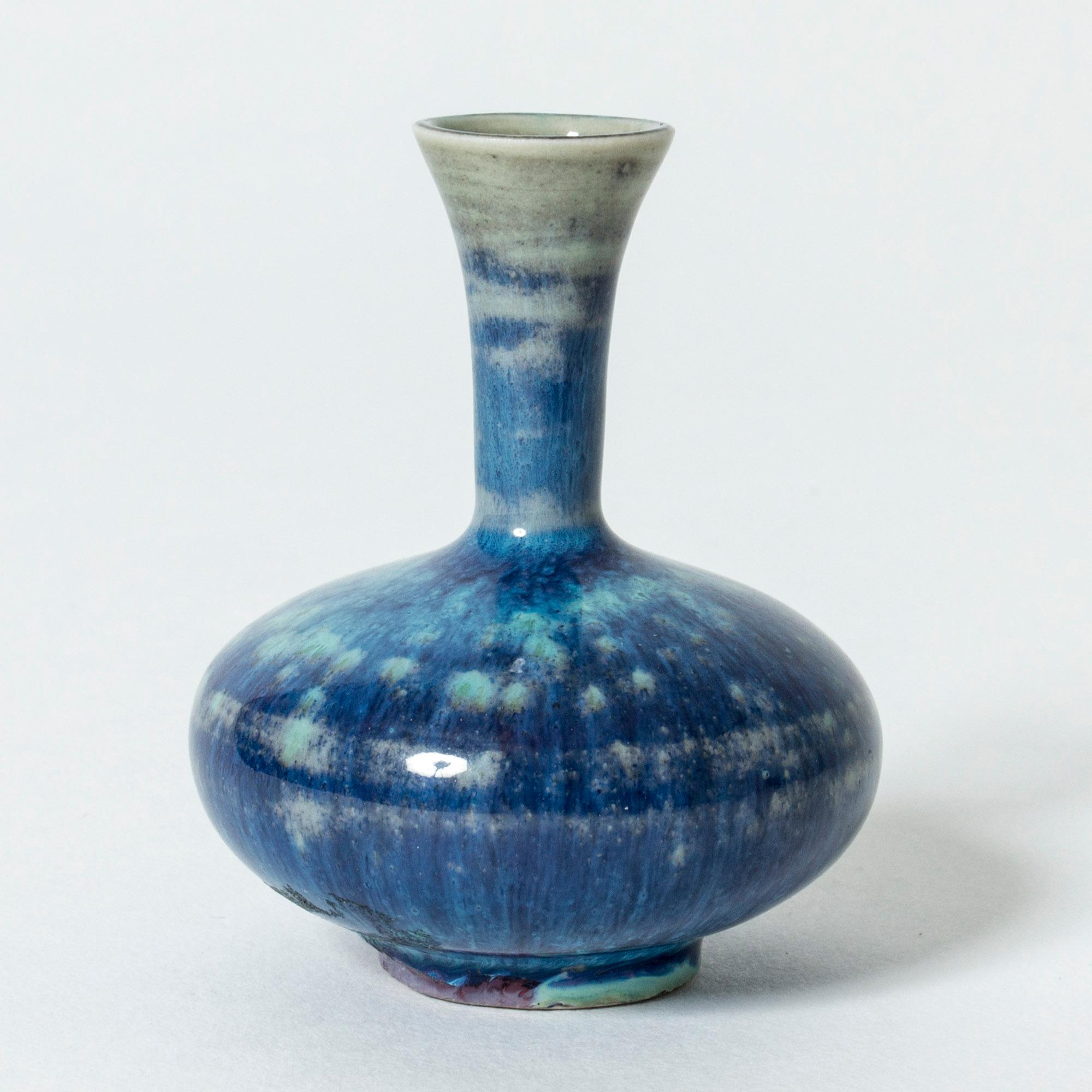 Beautiful miniature stoneware vase by Berndt Friberg. Vibrant “Aniara” glaze in blue and aquamarine tones.
