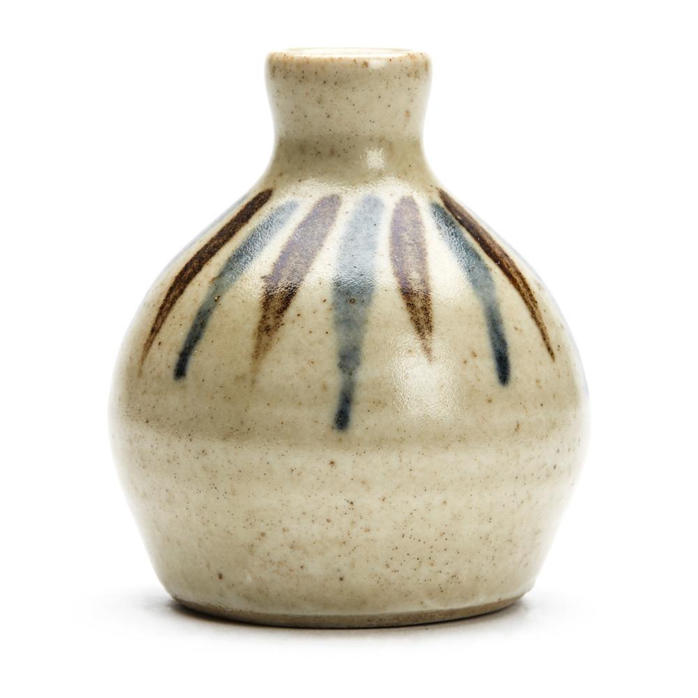 A miniature vintage Leach Pottery Studio Pottery vase decorated with blue and brown painted lines on a light stone glazed ground. Attributed to David Leach the vase is of rounded bulbous shape has a narrow top and unglazed foot and with an incised