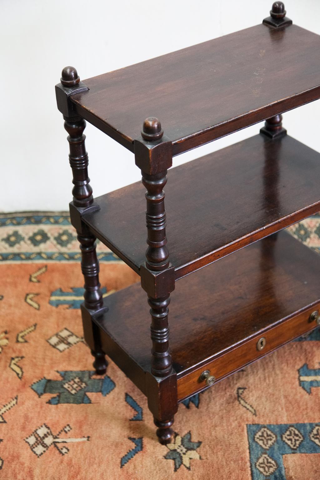 Miniature three-tiered server is solid mahogany and the drawer is also lined with solid mahogany. It has nicely turned support pillars and legs with acorn finials.