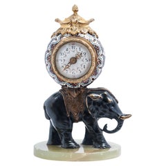Miniature time piece pendulum of a bronze elephant