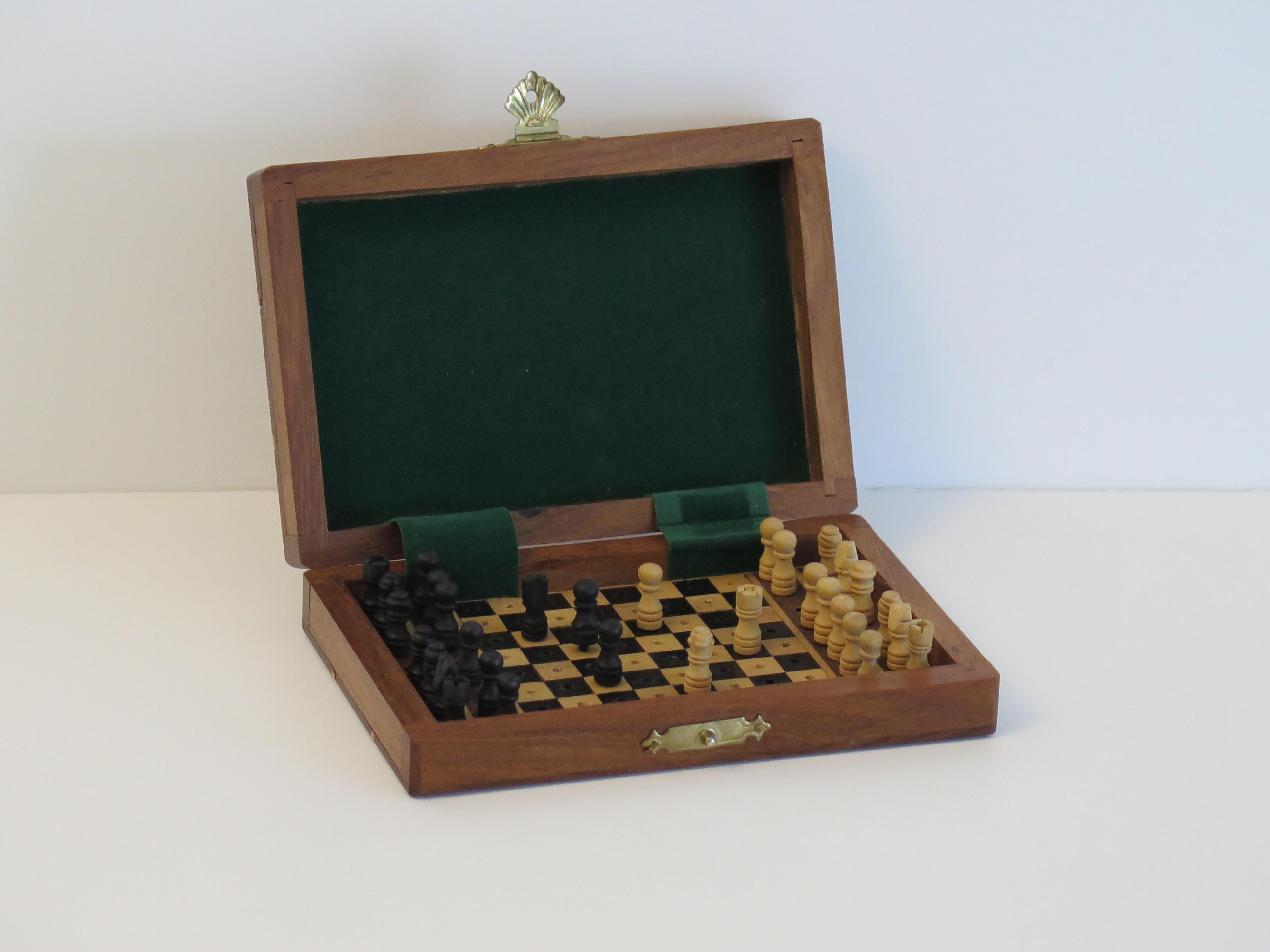 This is a good quality handmade Miniature or travelling wood chess set game of 32 pieces in its own inlaid hardwood box, which we date to the mid 20th century, circa 1940s.

The small dimensions of this piece ( nominally 6 x 4 x 1.3 inches) allow
