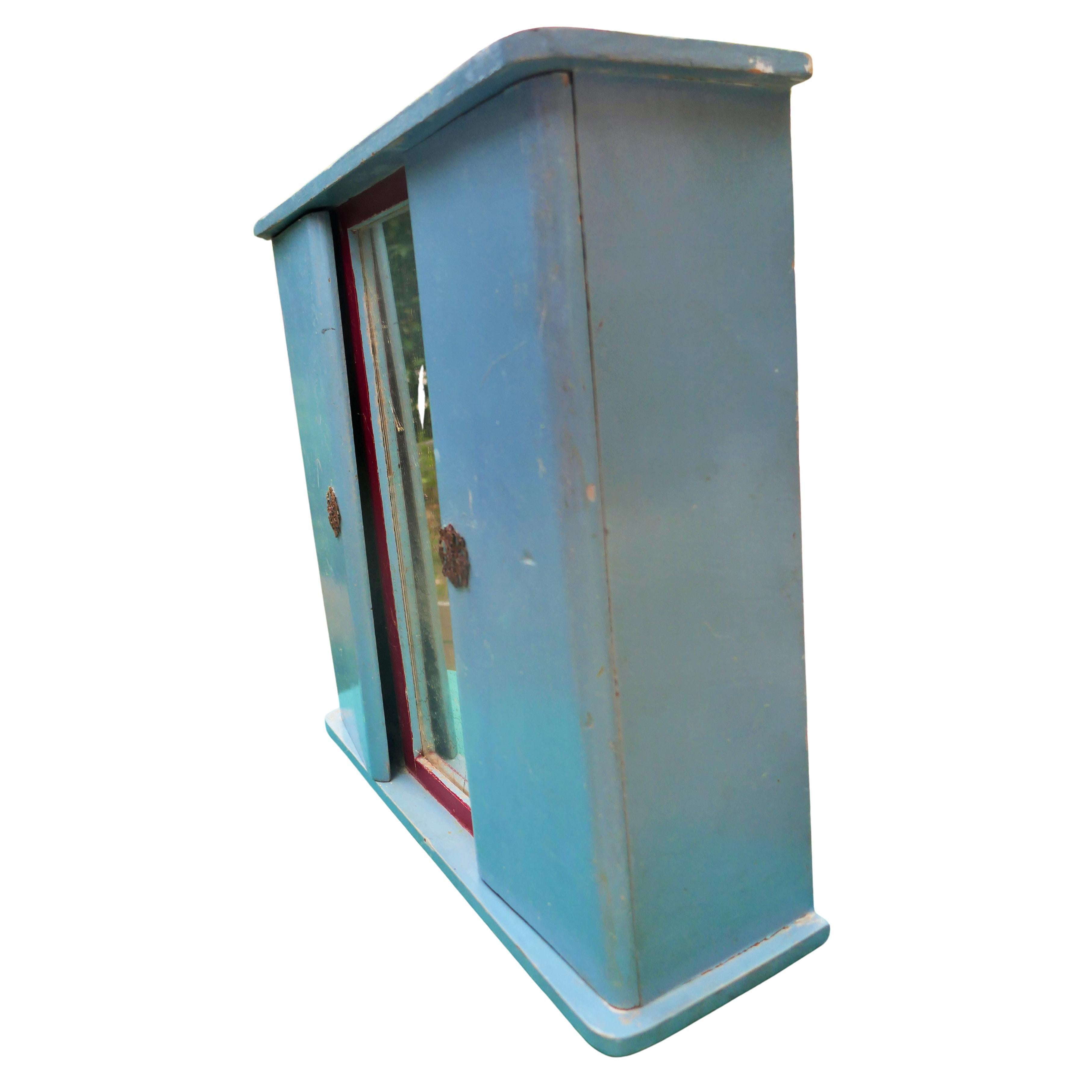 Wood Miniature wardrobe. Oxidized mirror For Sale