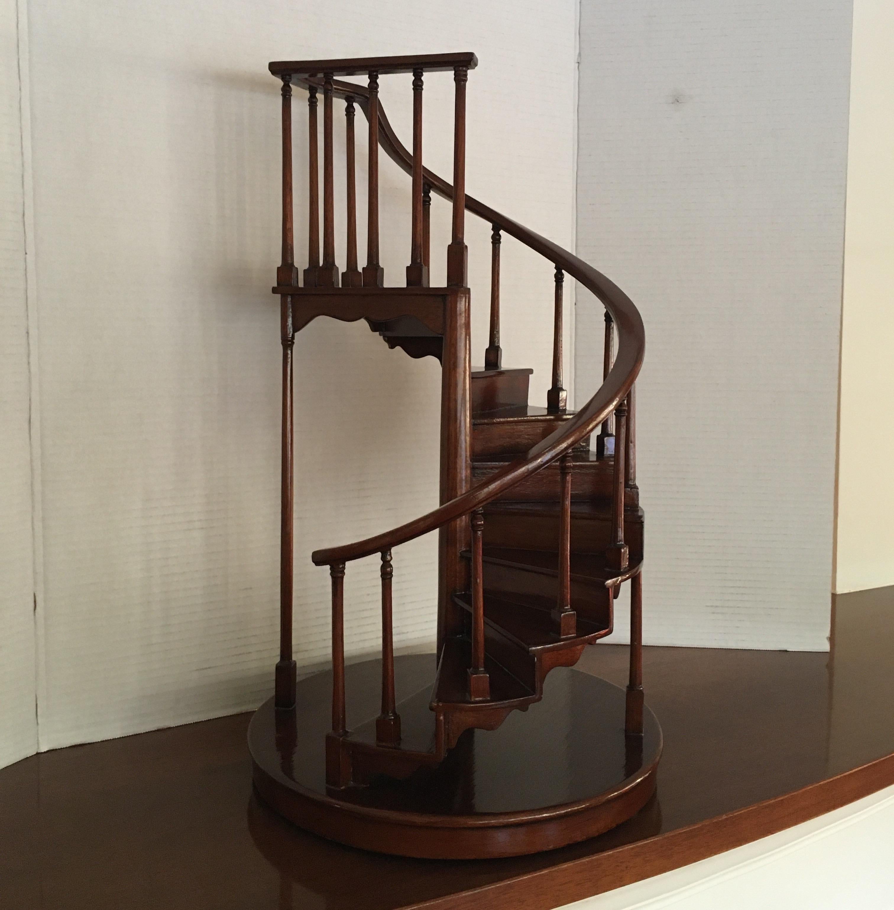 A miniature mahogany wood staircase by Maitland Smith.