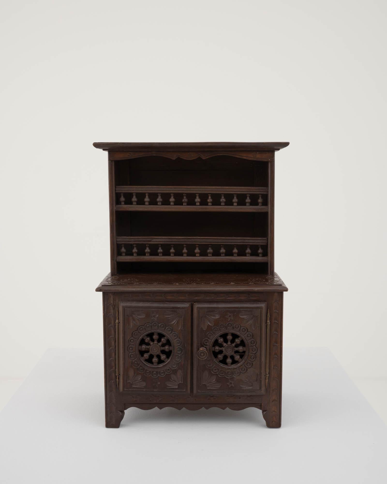 This highly eclectic piece takes influences from baroque to gothic to empire styles, sporting oriental reminiscences. This small cabinet is a product of a time when Europe started to trade with the Far East, new styles were on the rise, coming from