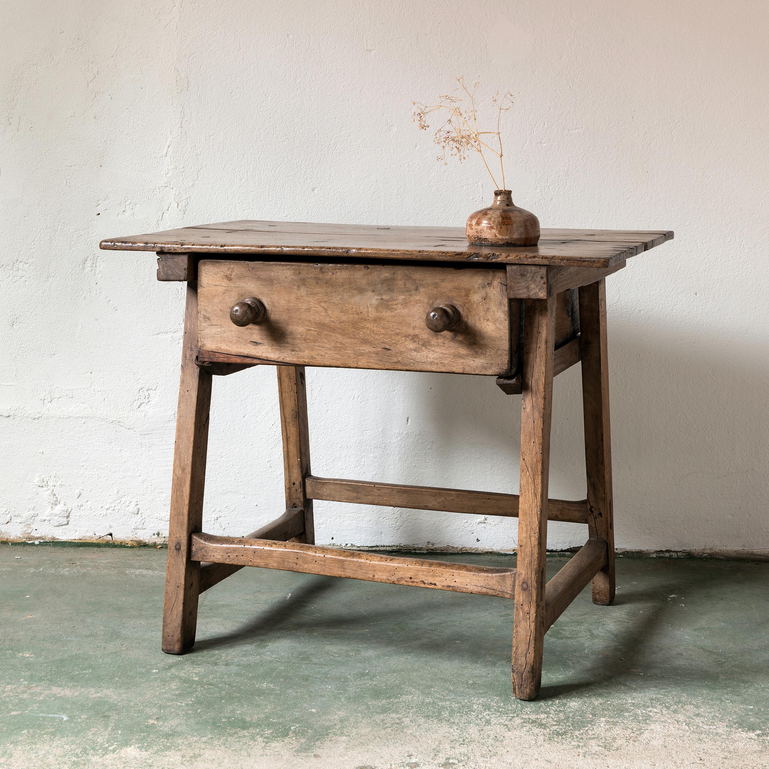 A very elegant small console or side table with one drawer in silky smooth walnut. Beautiful patina, works in a traditional or contemporary setting.