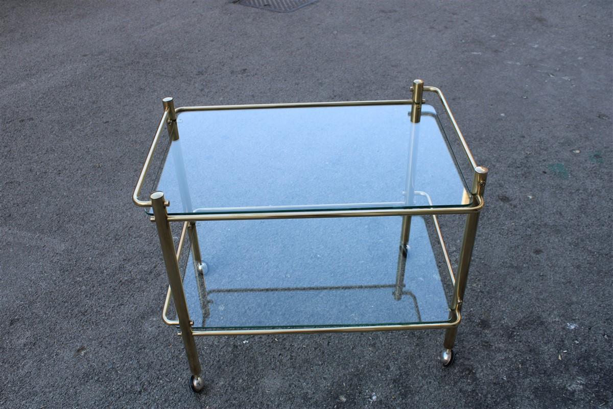Minimal bar cart Italian design gold brass 1970s glass transparent top.