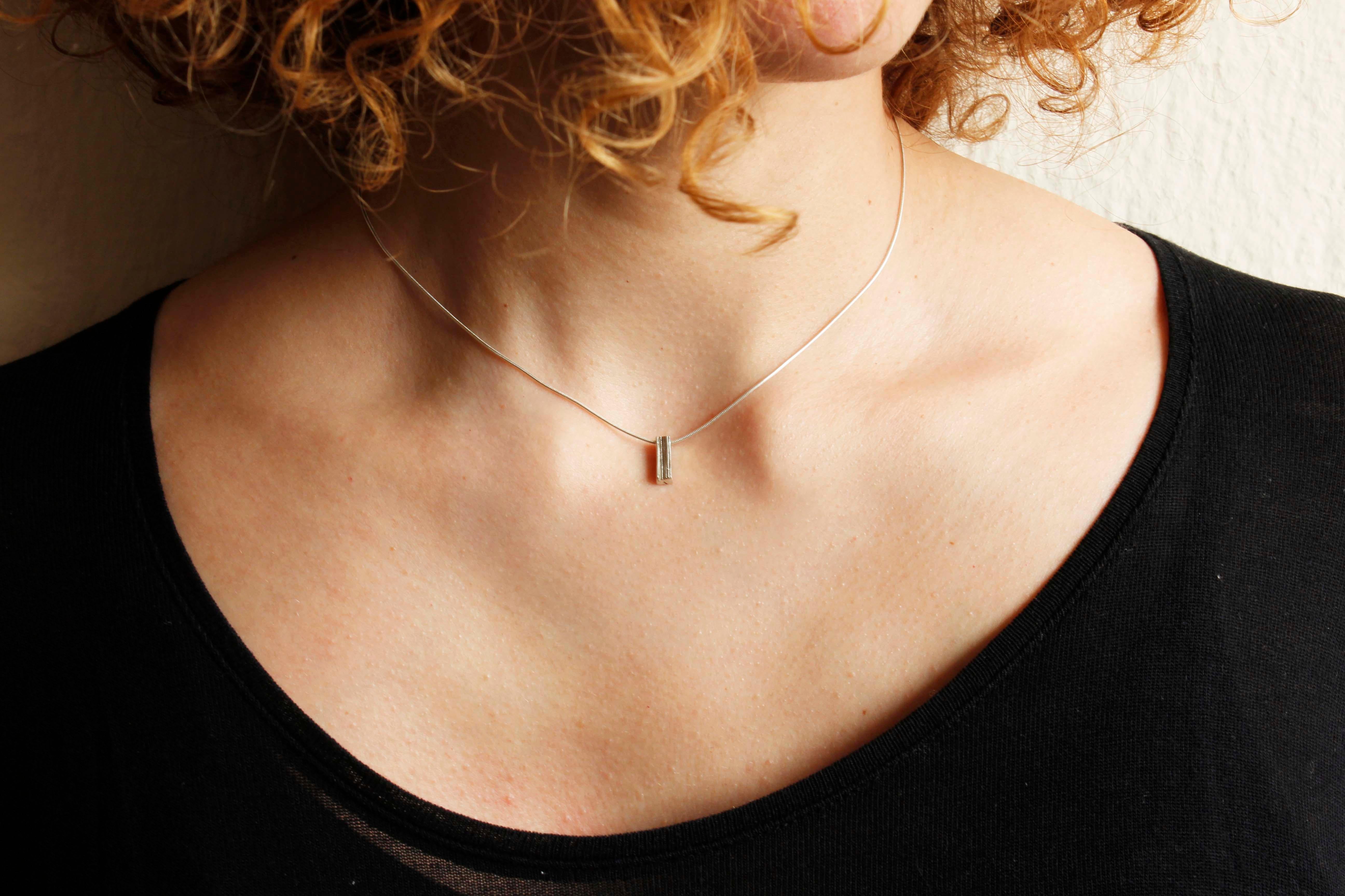 Minimal eco silver bar necklace with a sculptural surface, is perfect to give an extra detail to your outfit!

Made from eco silver sheets soldered together to create this unique texture of layers.

The necklace is part of project_x, a collection