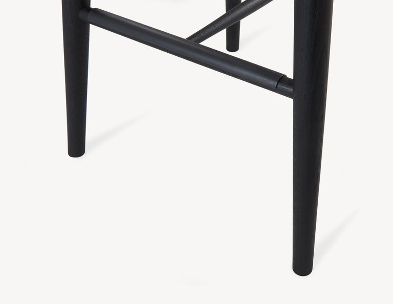 Canadian Minimal Black Bar Stool with Brass Foot Rests by Coolican & Company For Sale