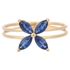 Minimaler blauer Saphir-Blumenring aus 14k massivem Gelbgold