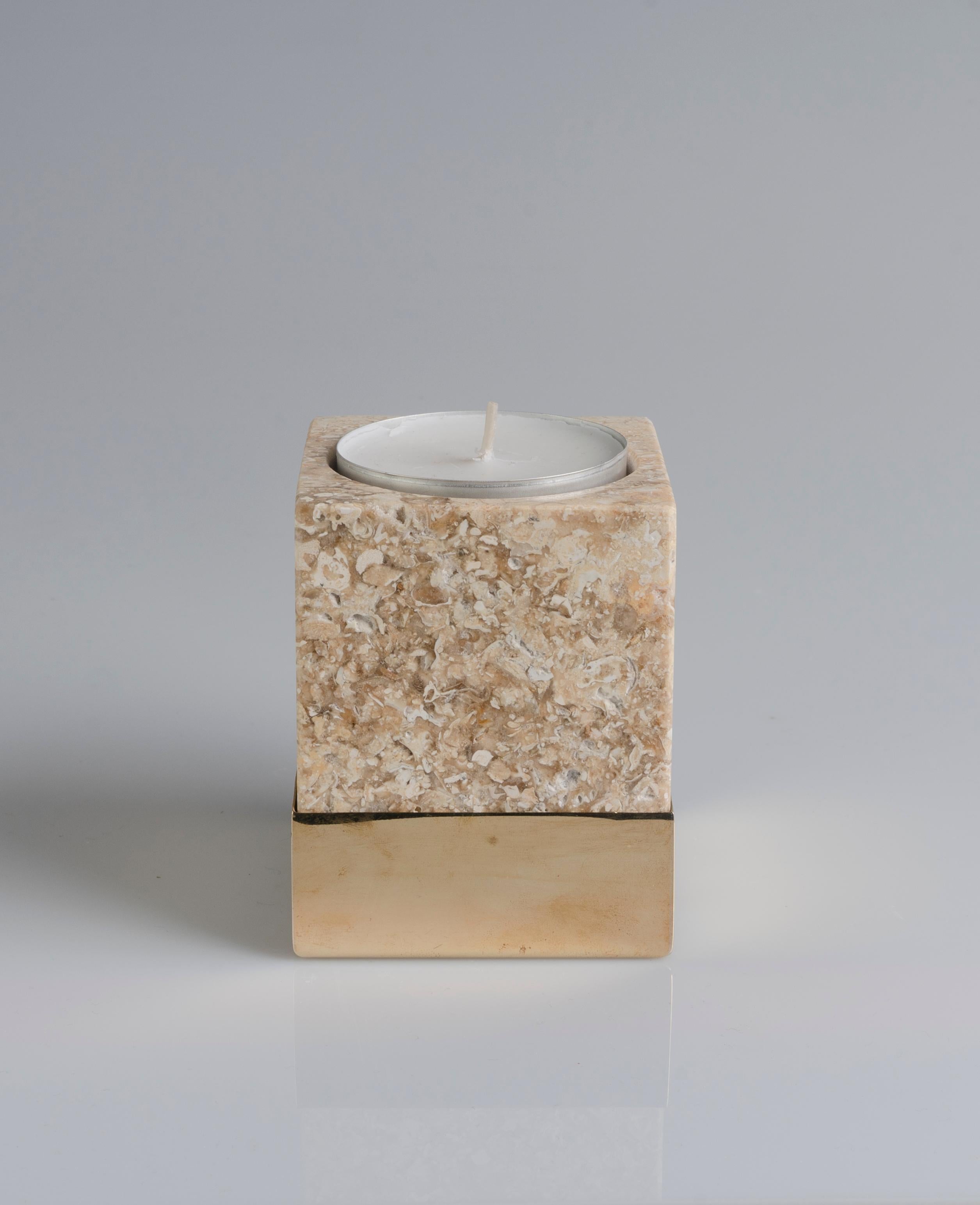 This candleholder is made of Greek Marble.The base is made of polished brass. Candle comes pre-filed. After use, candle hole is made to fit tea lights.