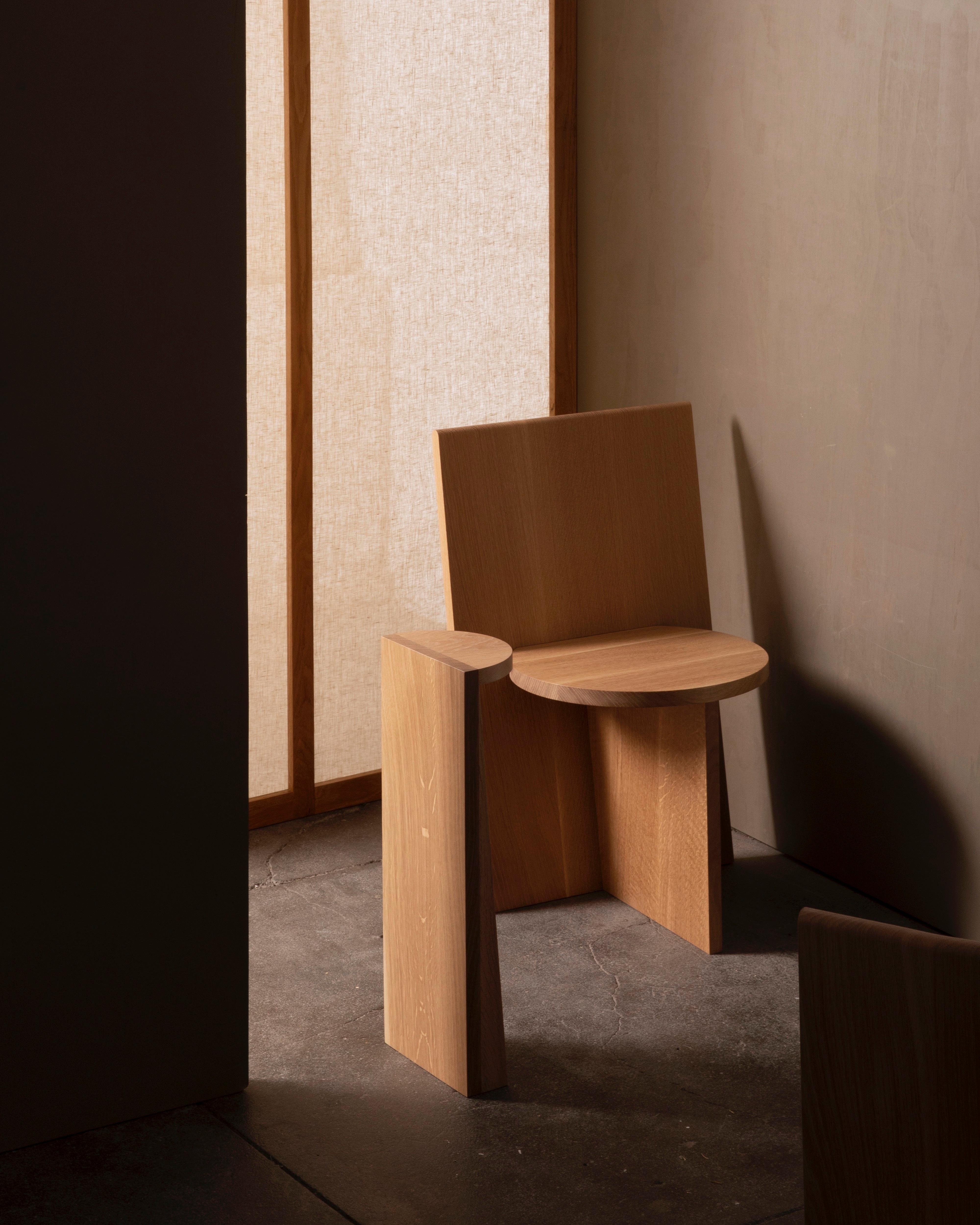 A simple wooden half circle and elongated wedge. The perfect pedestal for precious artifacts. Works as a nightstand, end table or plant stand. 

Counterweighted with hidden steel in the base that provides balance on smooth surfaces. 

This