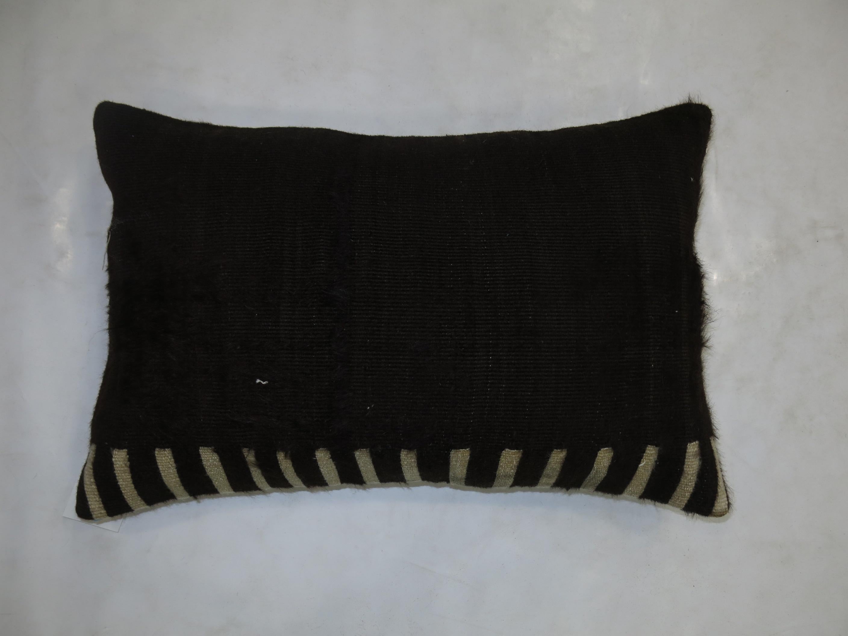 A pillow made with a Turkish Mohair rug.

15'' x 23''