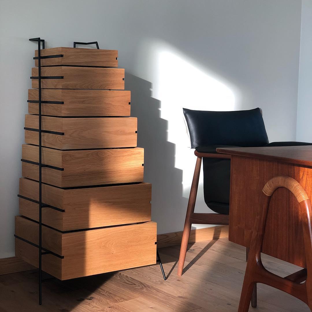 Sutoa means to contain in Japanese. Sutoa drawer fulfills the aesthetic look of a storage chest. It is based on a discreet steel frame combined with wooden stack-able drawers in massive oak. Boxes of different sizes serves various purposes to