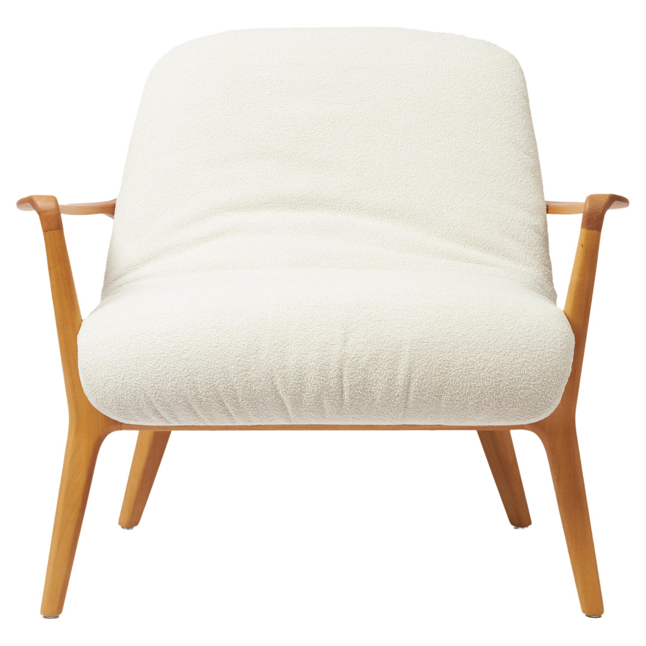 Minimal Style Insigne Armchair Sculpted in solid wood, textiles seating For Sale
