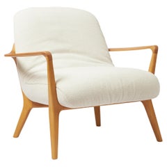 Minimal Style Insigne Armchair Sculpted in walnut solid wood finish, textiles