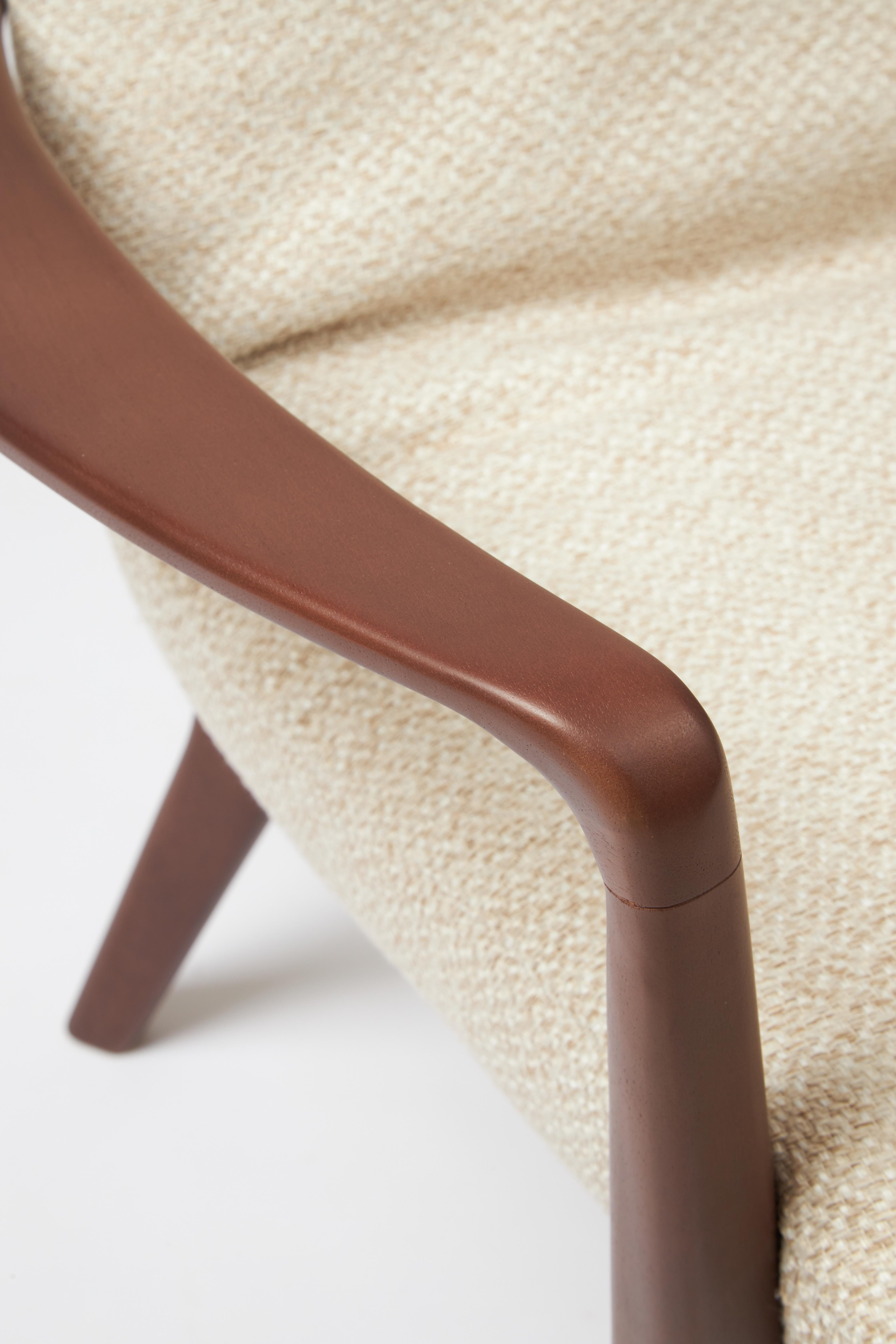 Minimal Style Insigne Armchair Sculpted in walnut wood finish, textiles seating For Sale 1