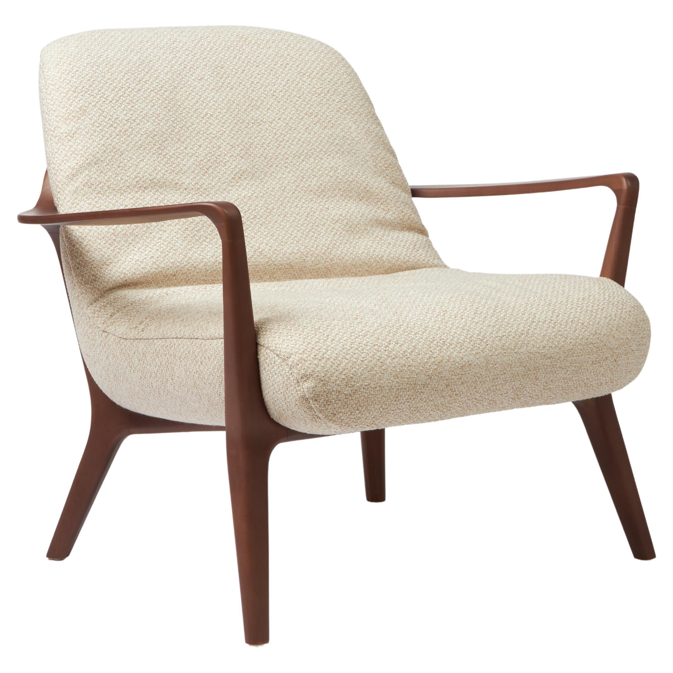 Minimal Style Insigne Armchair Sculpted in walnut wood finish, textiles seating For Sale
