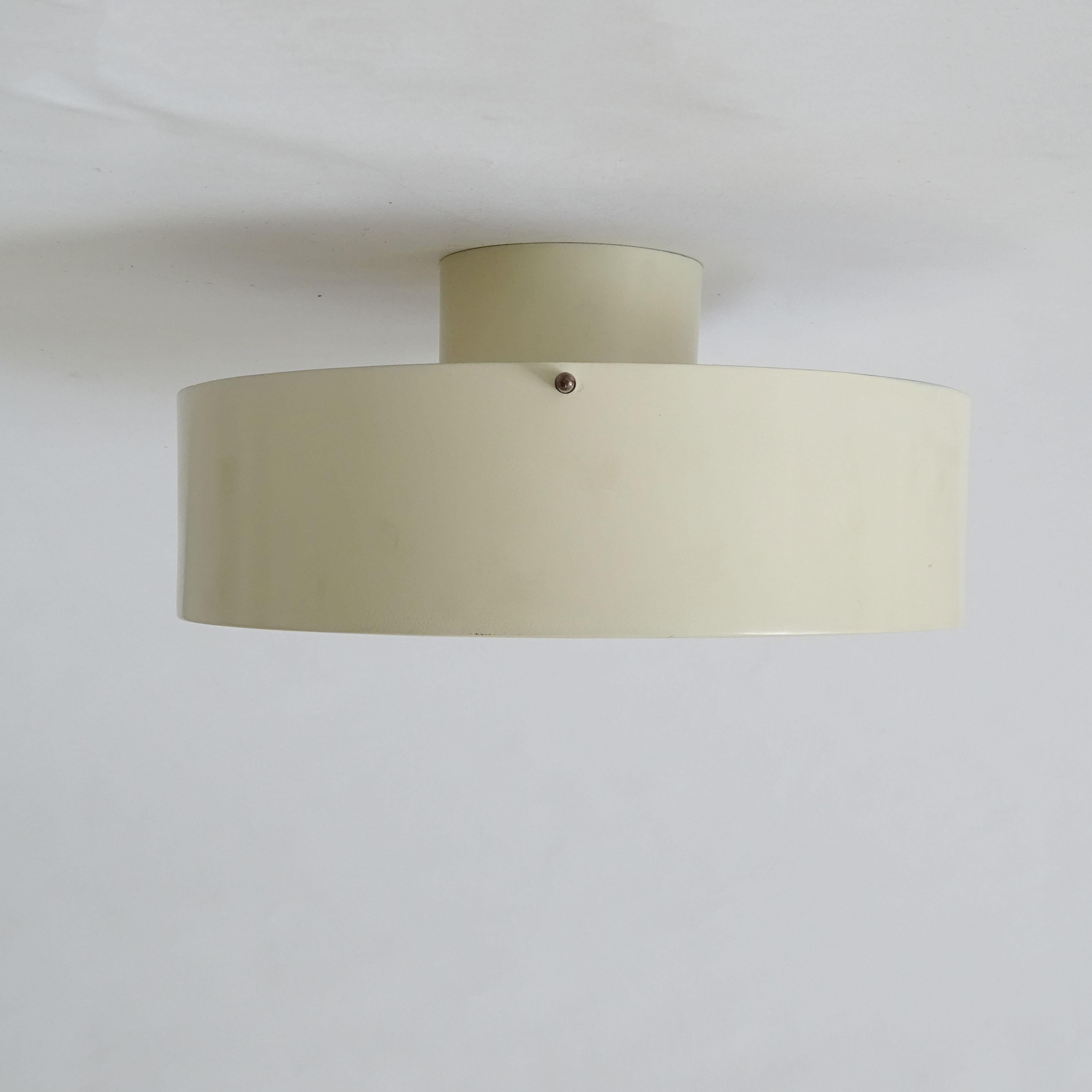 Cream flush mount ceiling lamp model: 450 by Tito Agnoli for Oluce, 
Italy 1960s
Reference: O-luce Thomas Brauniger 
Luminaires Moderniste
Berlin 2015 p. 117.