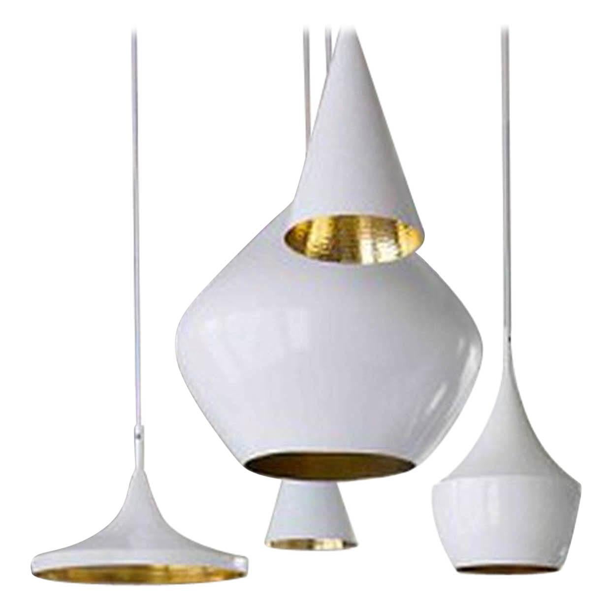 Minimal Tom Dixon beat fat white pendant light fixture, contemporary. Gorgeous piece. Retails for 550 USD. 

The Tom Dixon beat fat pendant is part of a series of lights inspired by the handmade brass cooking pots and water vessels found in India.