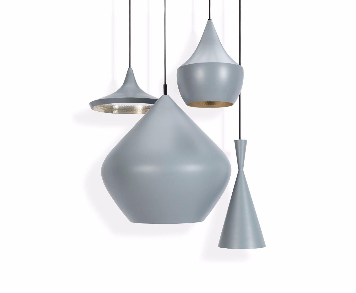 Minimal Tom Dixon beat tall gray pendant brass light fixture, contemporary. Gorgeous piece. Retails for 575 USD. New in box, never installed.

Perpetuating the skills of artisan craftsmen in Northern India, Beat’s origin is a re-purposed water